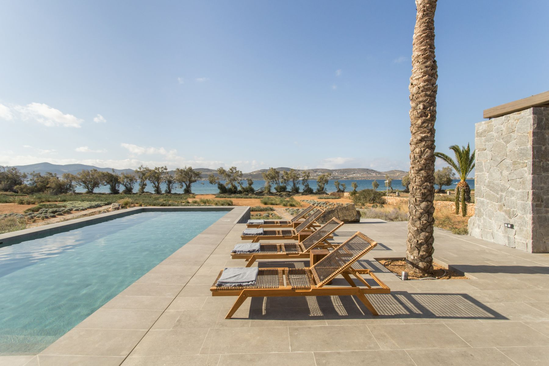 Pool with sun loungers at Villa Aliki, Paros
