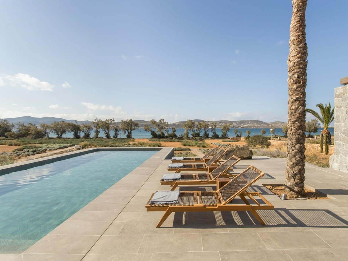 Pool with sun loungers at Villa Aliki, Paros