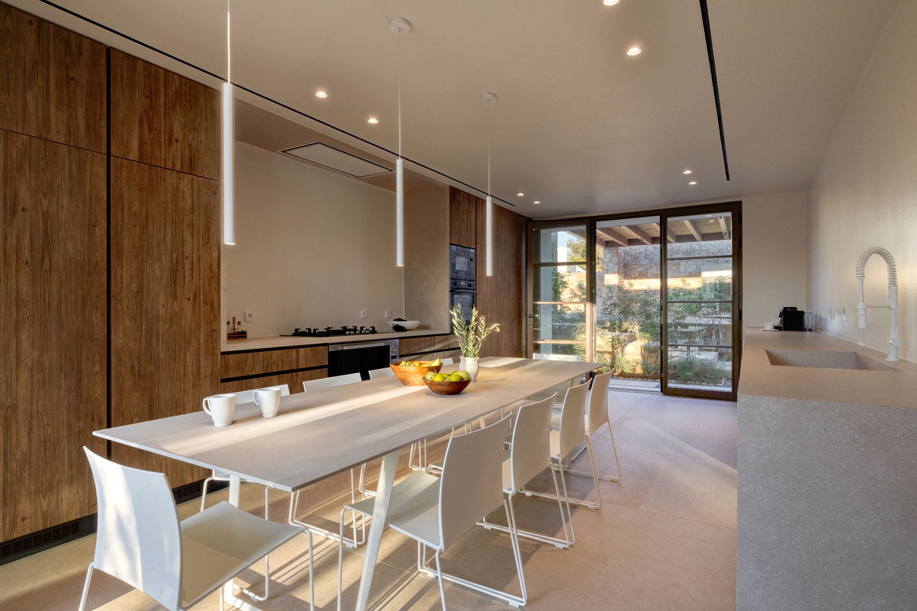 Kitchen with dining table at Villa Althea, Paros