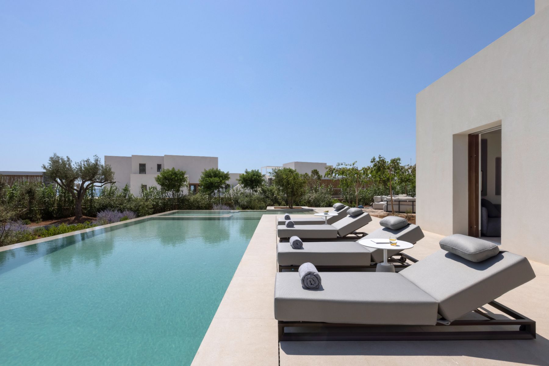 Pool with sun loungers at Villa Althea, Paros