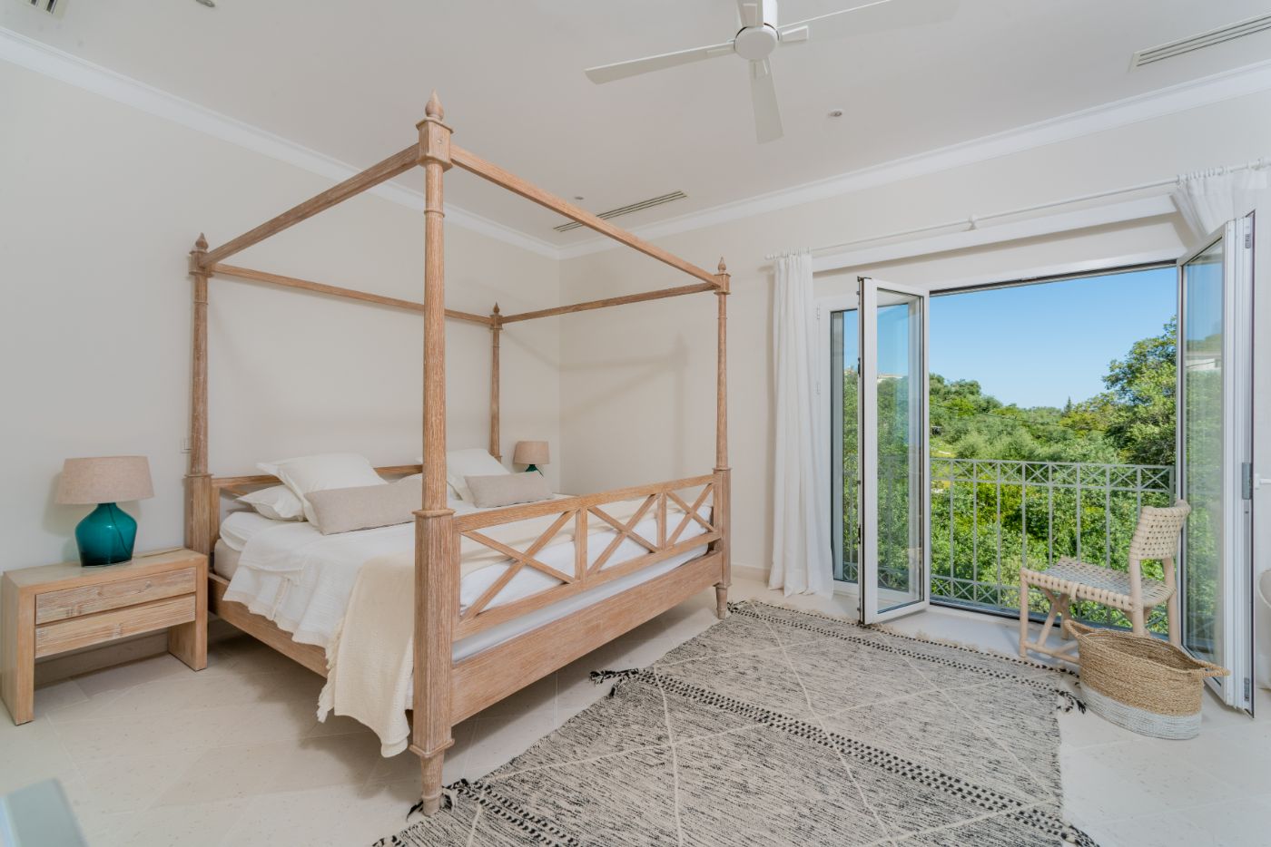 Bedroom with four poster bed at Villa Anthi