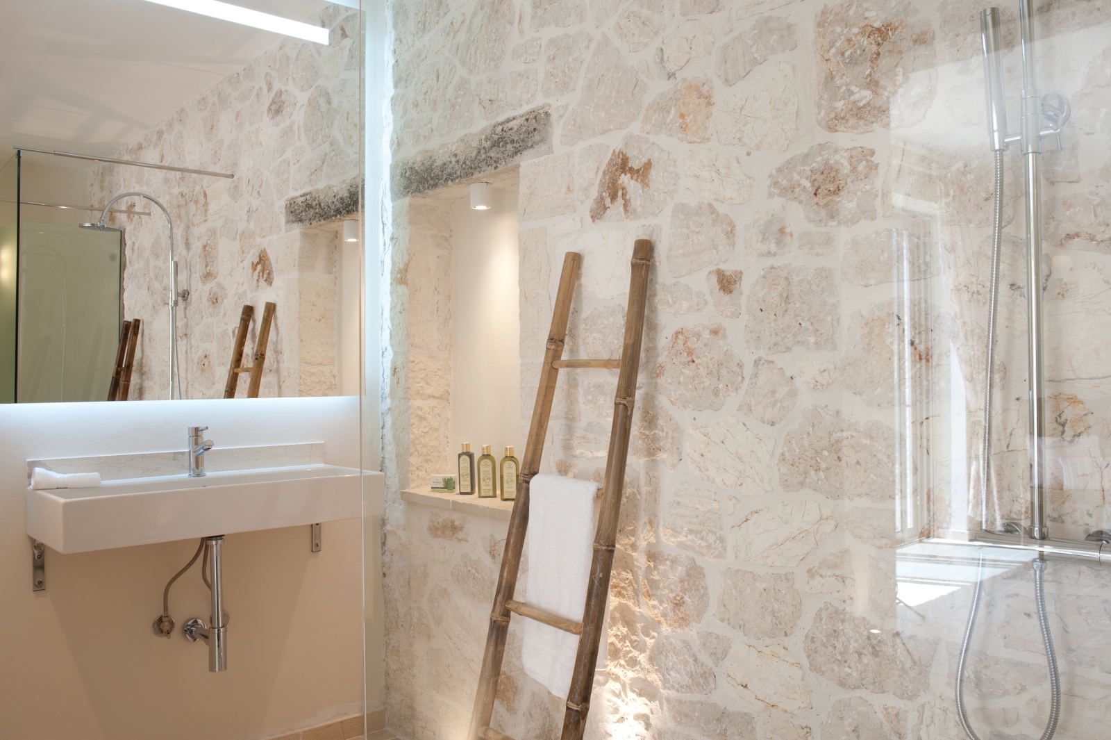 Stone tiled bathroom with walk in shower at Villa Dionysos, Corfu