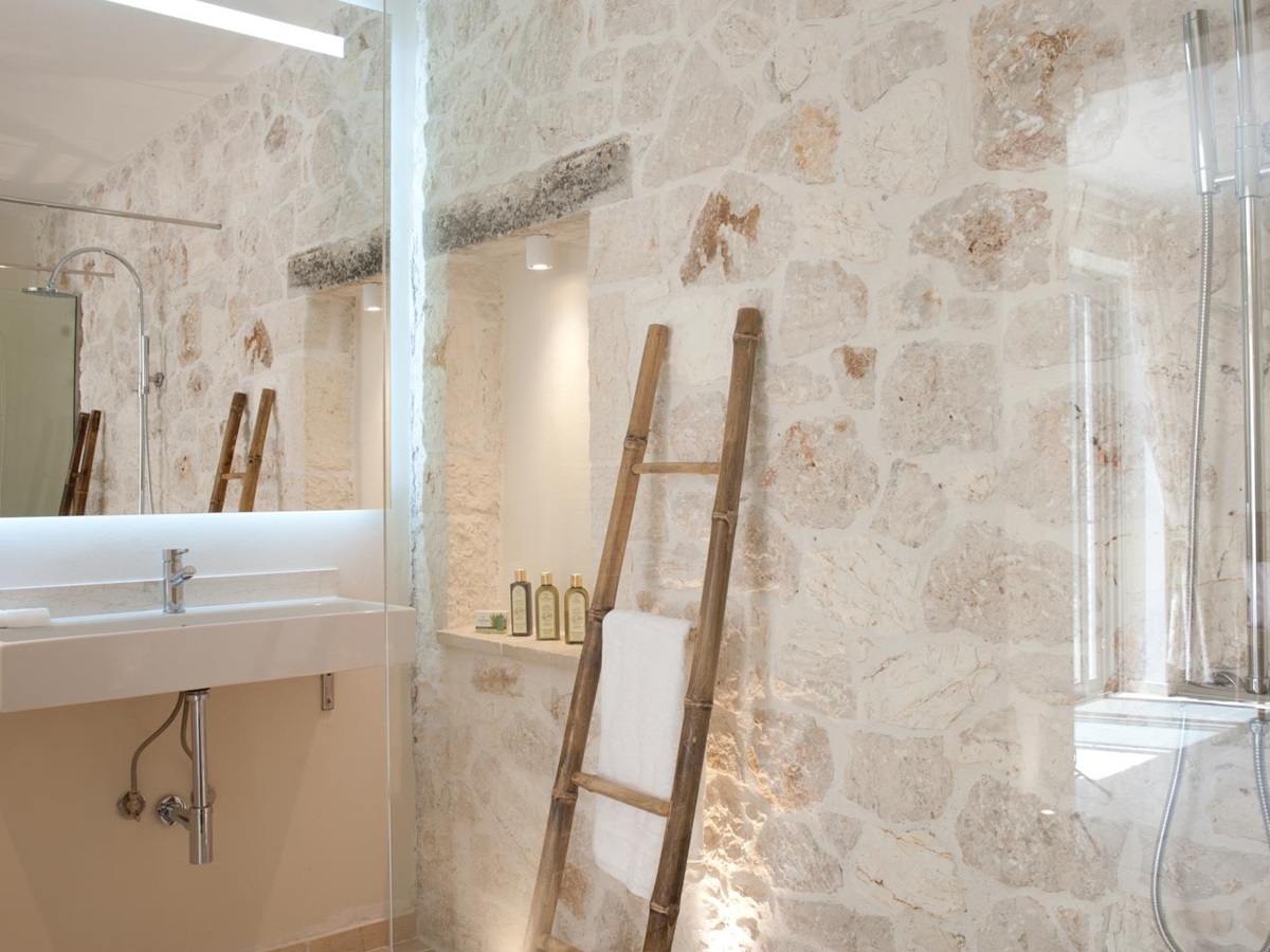Stone tiled bathroom with walk in shower at Villa Dionysos, Corfu
