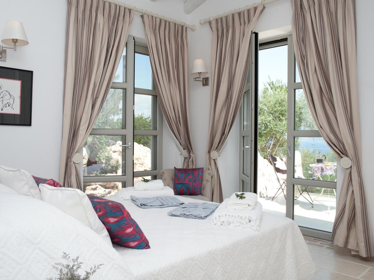 Double bedroom with view out onto sun terrace