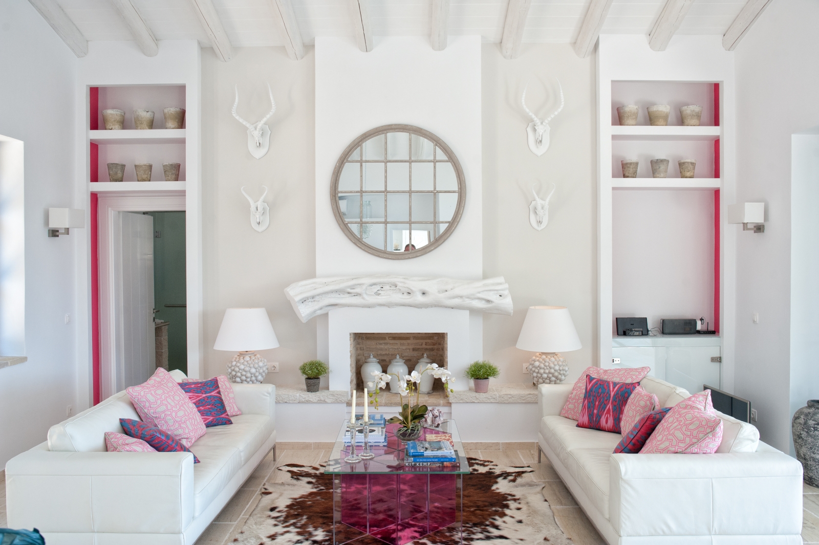Living room with white and pink furnishings at Villa Dionysos, Corfu