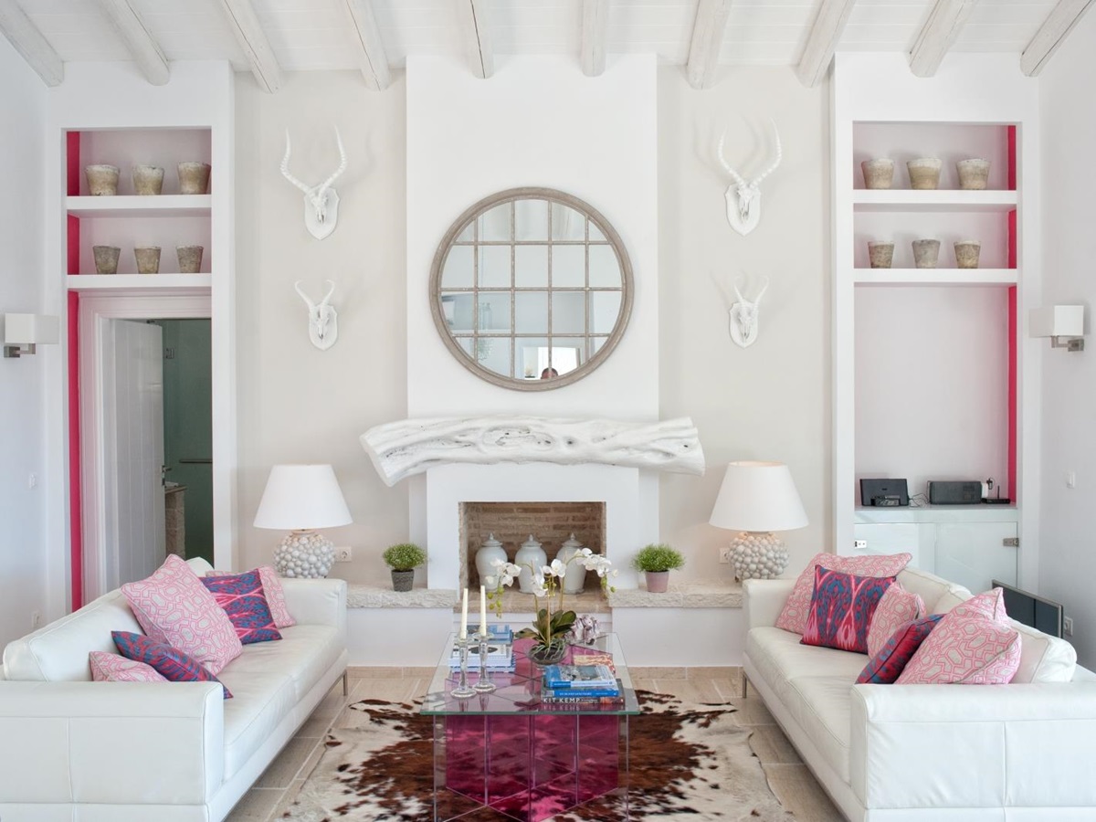 Living room with white and pink furnishings at Villa Dionysos, Corfu