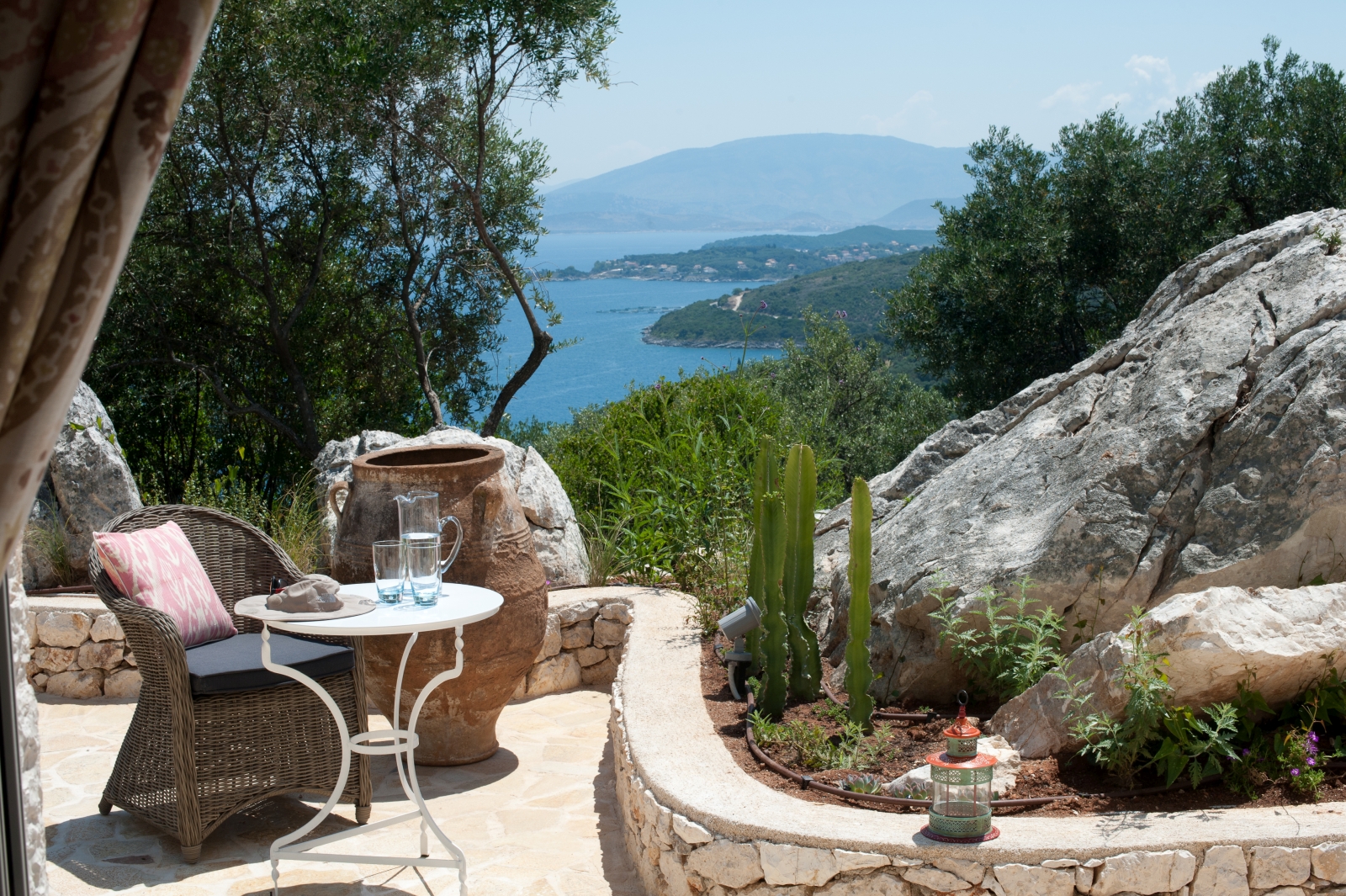 Secluded terrace seating with sea view at Villa Dionysos, Corfu