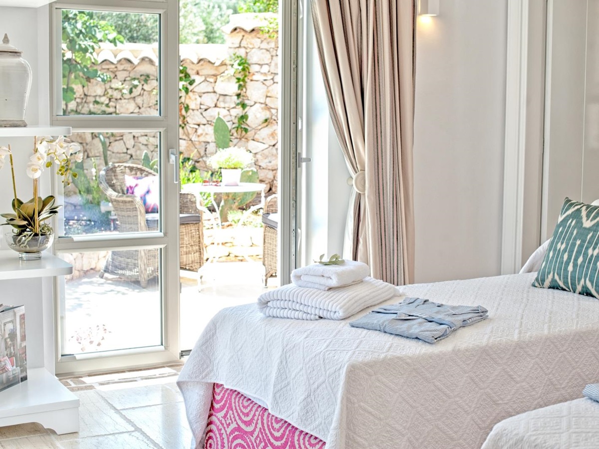 Twin bedroom with door onto terrace at Villa Dionysos, Corfu