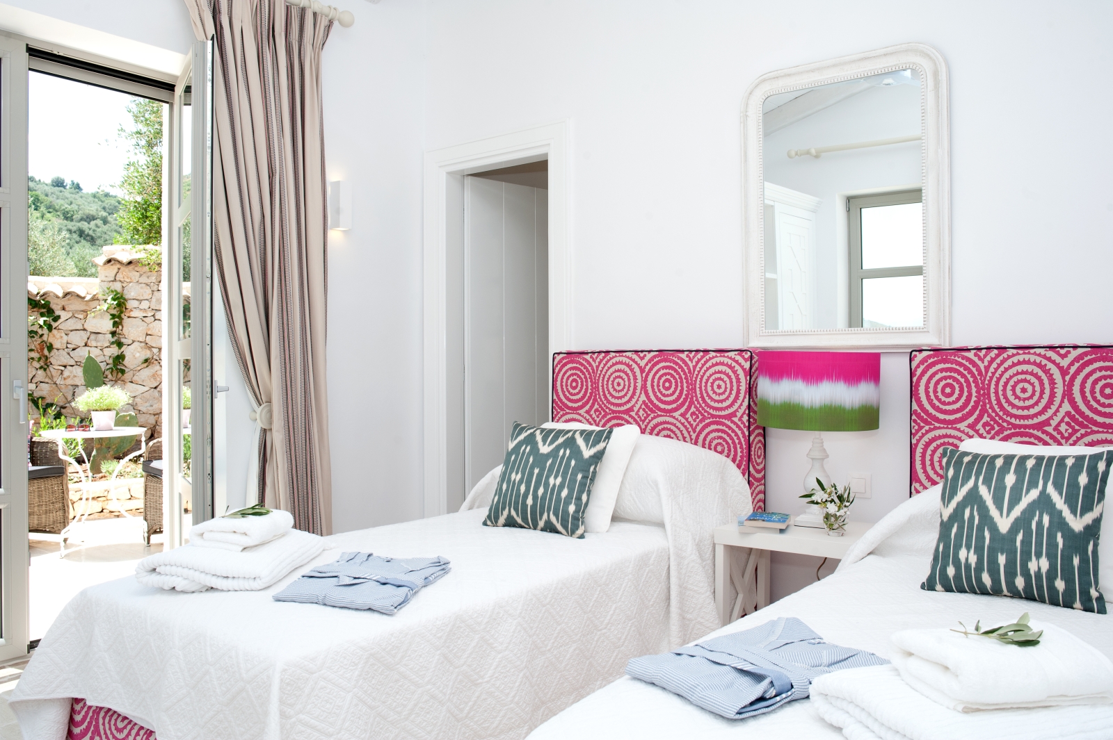 Twin bedroom with pink headboards at Villa Dionysos, Corfu