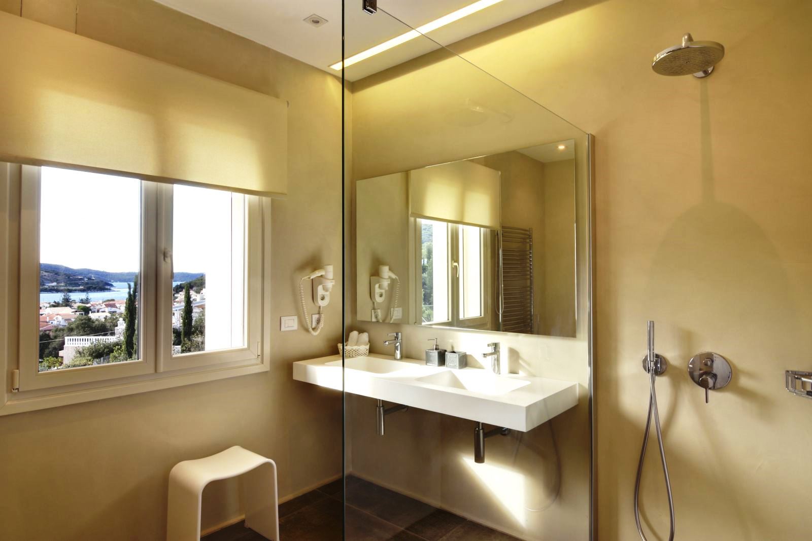 bathroom with mirror over sink at villa eleni in corfu, Greece