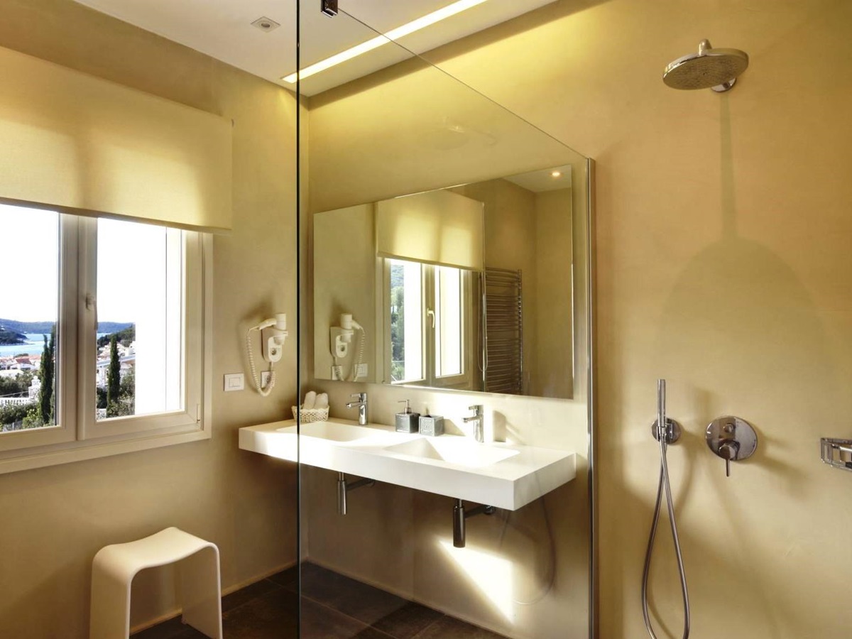 bathroom with mirror over sink at villa eleni in corfu, Greece