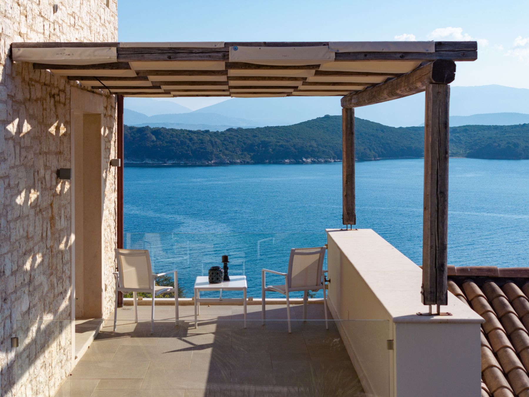 Balcony with seating and sea view at Villa Eleni, Corfu