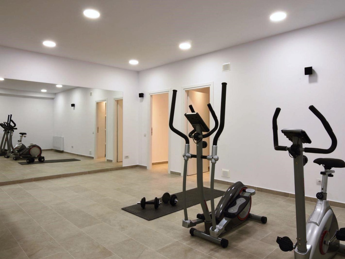 Gym equipment in room with big mirror at villa eleni in corfu, Greece