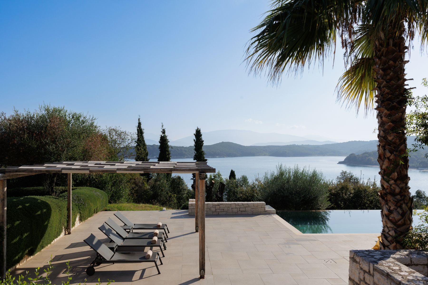 Pool with sun loungers at Villa Eleni, Corfu