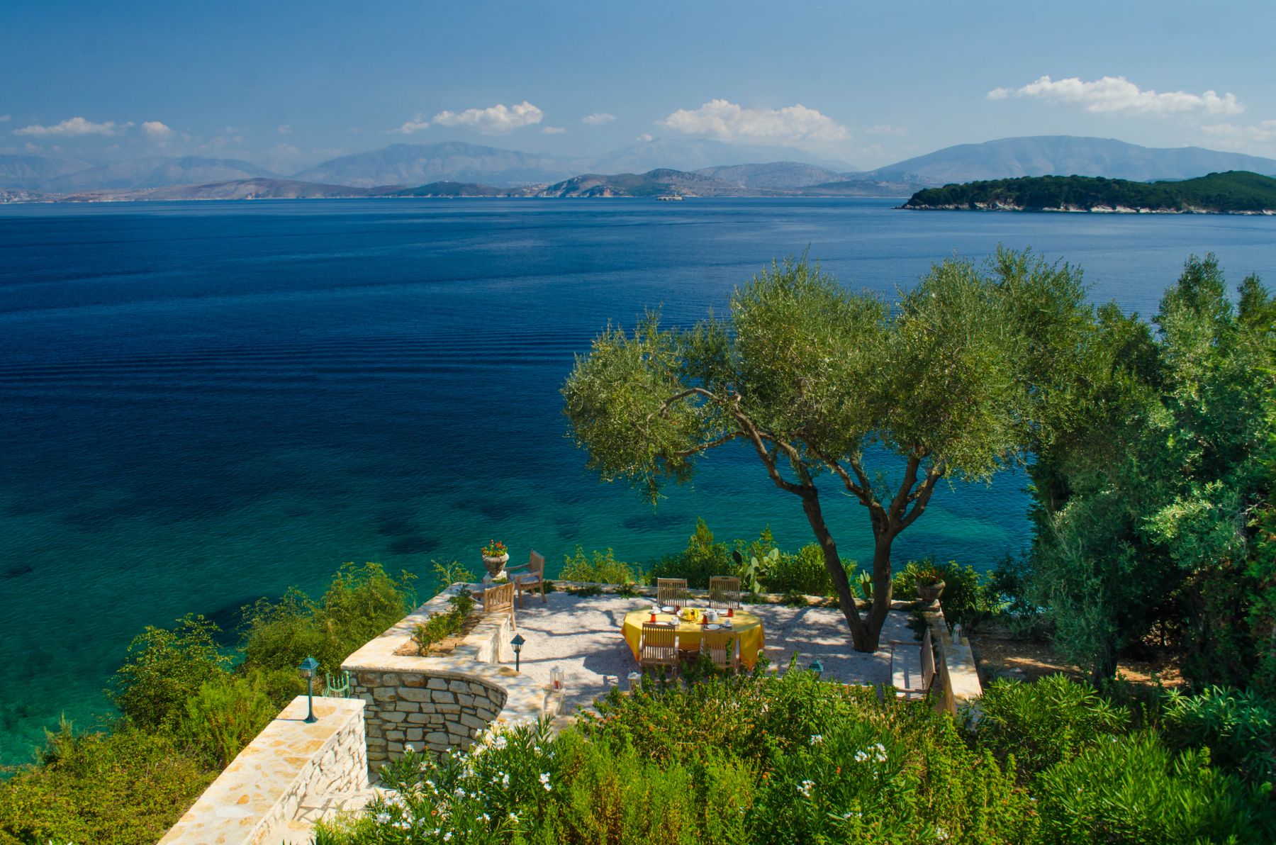 View of the sea and outdoor seating at Villa Elia, Corfu
