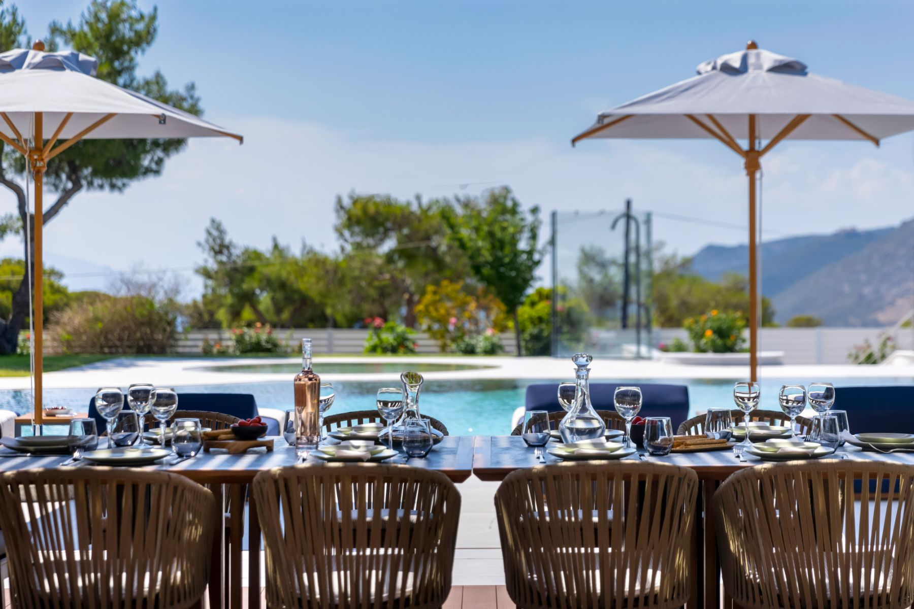 Pool with dining table at Villa Elysian 