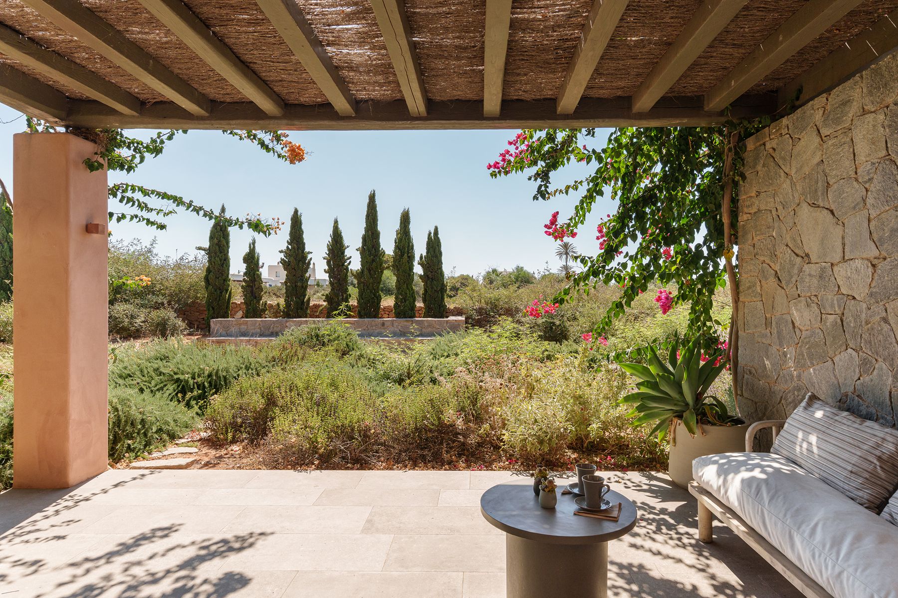 Terrace and seating with garden views at Villa Galini, Paros