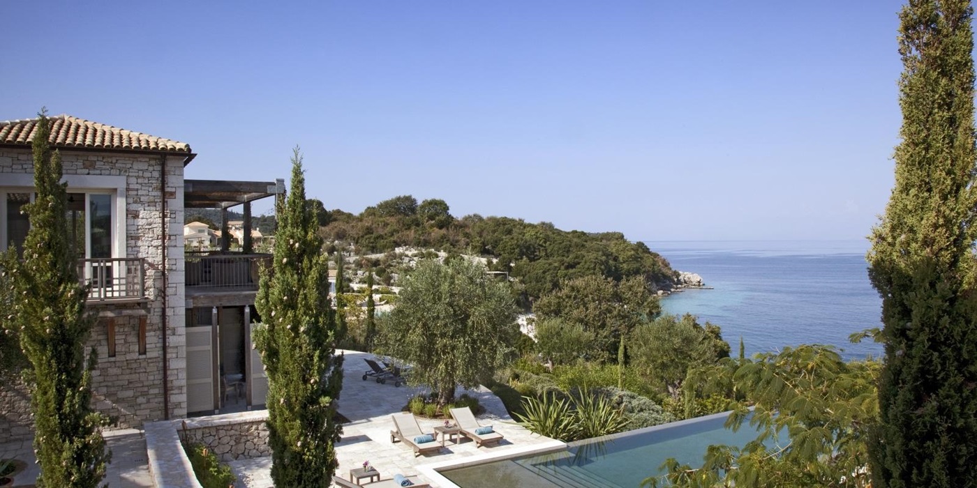 View of pool, pool area and sea from terrace at Villa Icarius on Corfu, Greece