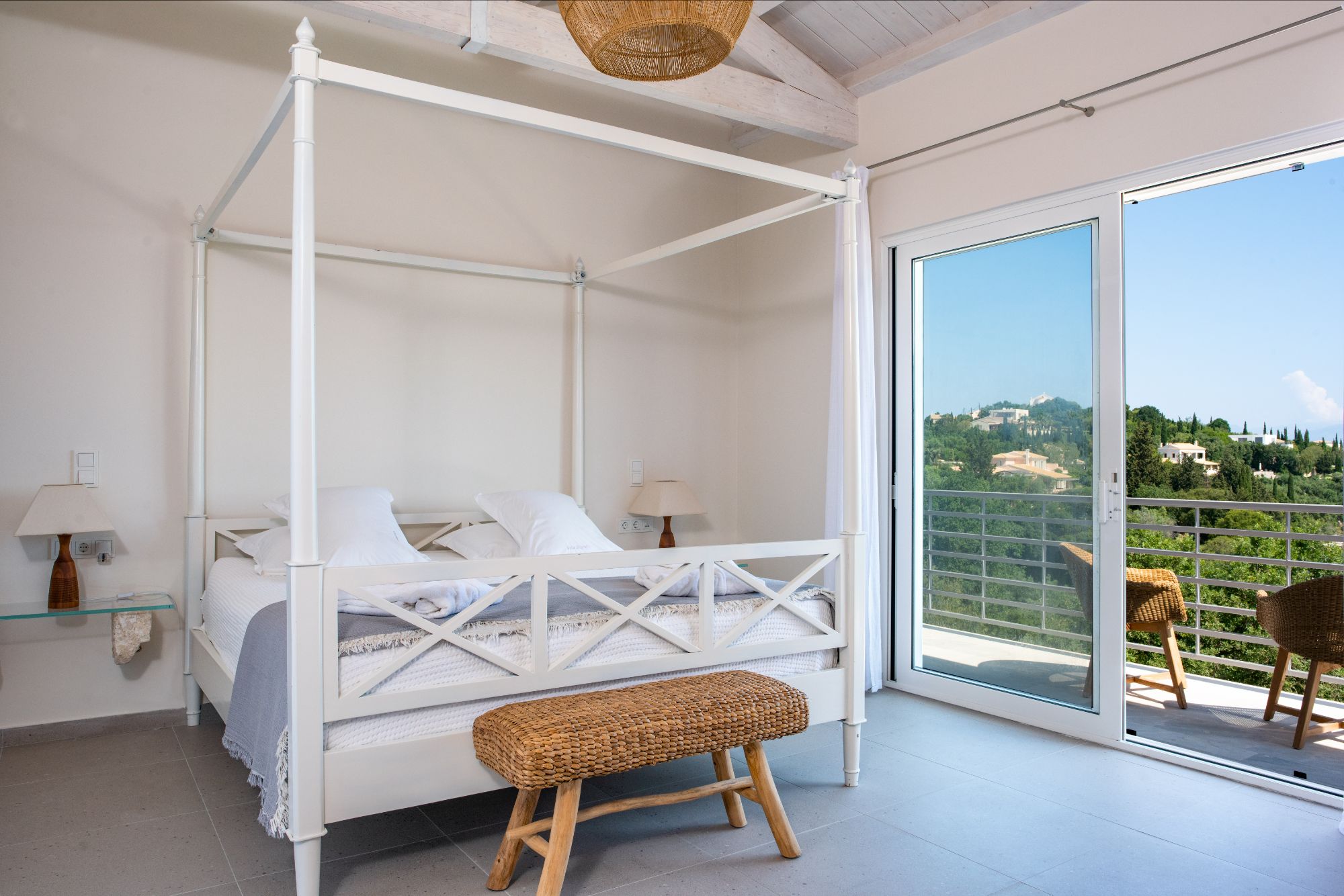 Bedroom with four poster bed at Villa Ioulia
