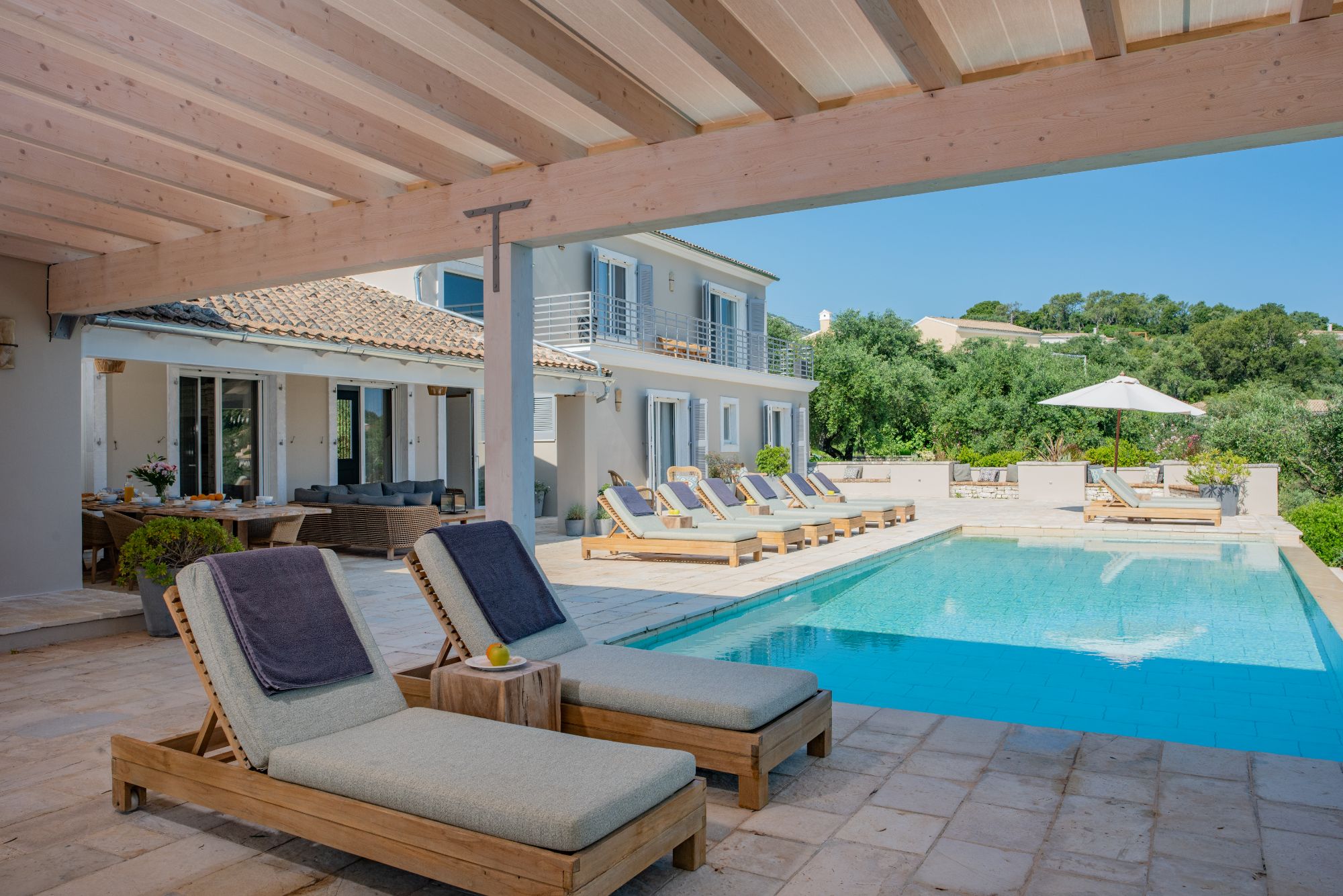 Terrace with sun loungers at Villa Ioulia