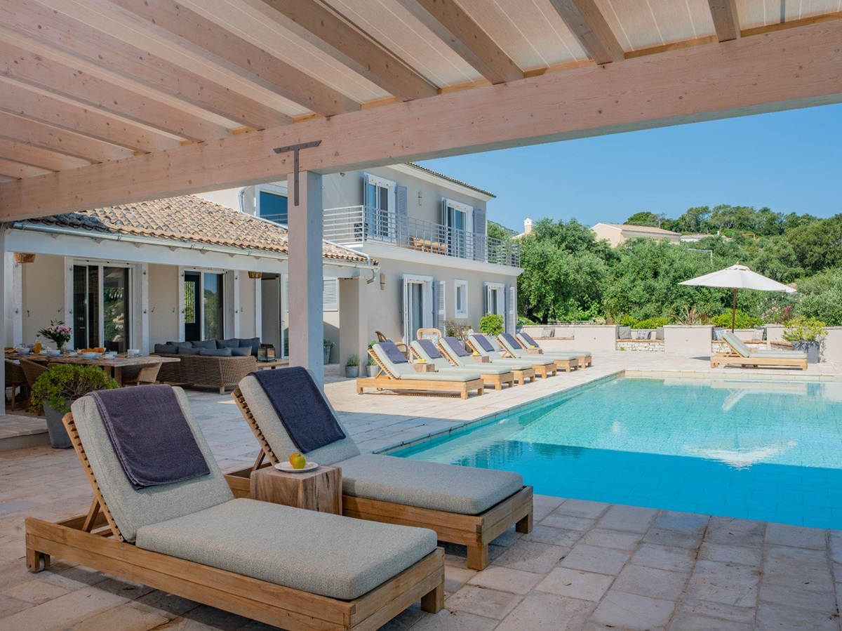 Terrace with sun loungers at Villa Ioulia