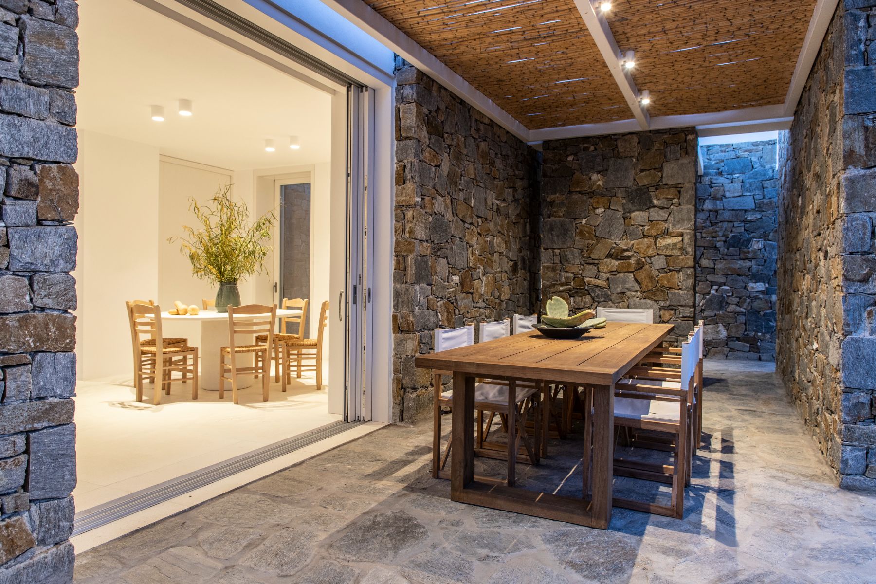 Dining terrace at night at Villa Irida, Paros