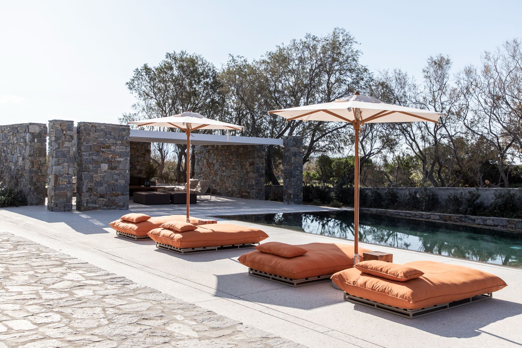 Pool with sun loungers at Villa Irida, Paros