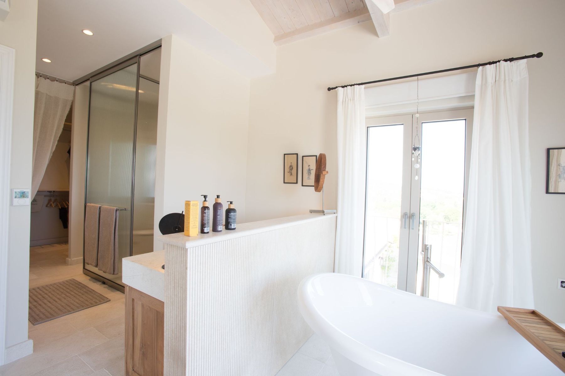 Master bedroom bathroom with bath tub and shower at Villa Jasmine, Corfu