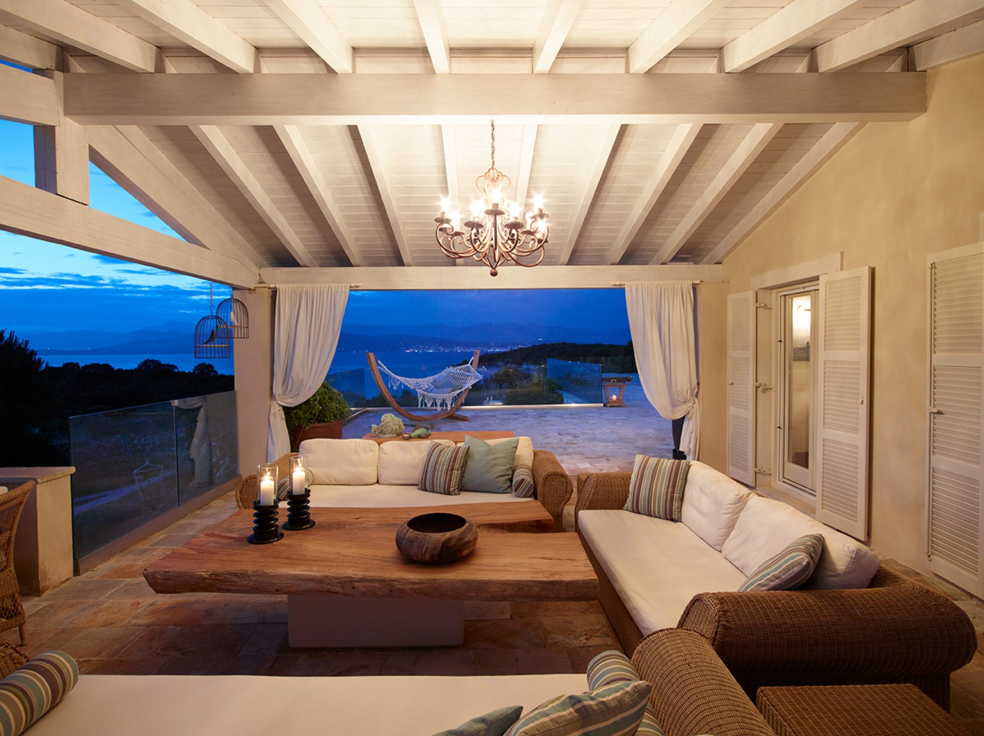 Covered outdoor living area at Villa Jasmine in the evening