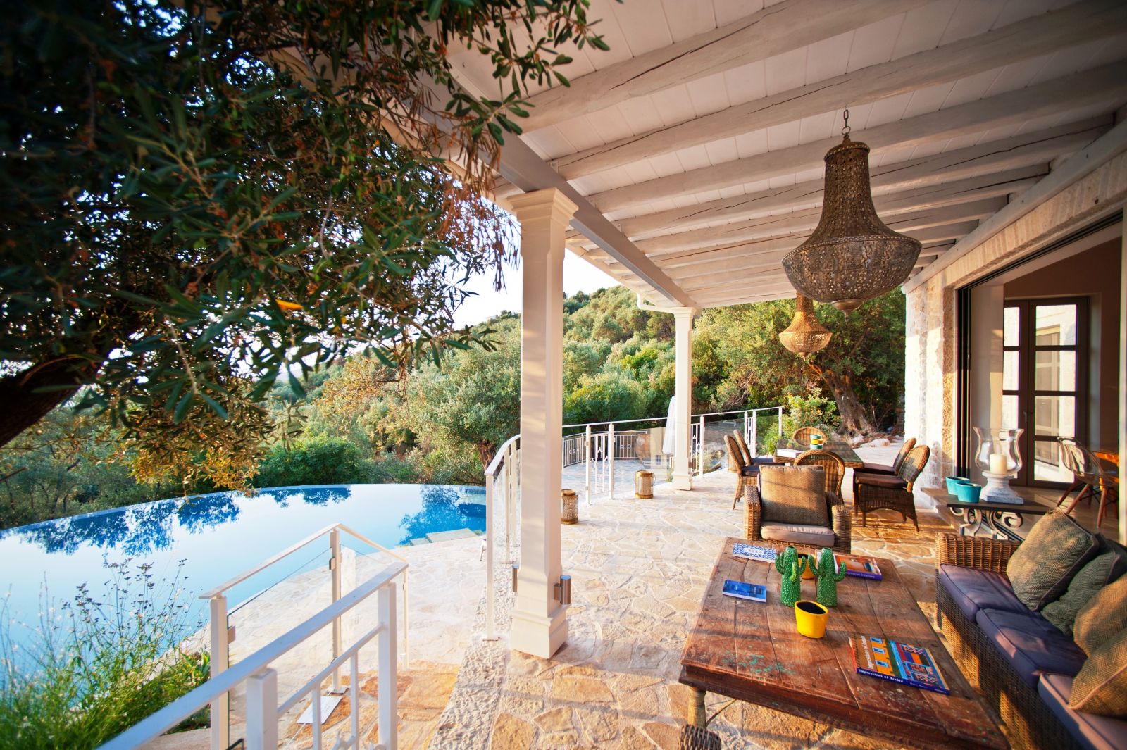 Terrace area with outdoor furniture at the front of villa kalamaki in corfu, Greece overlooking the pool
