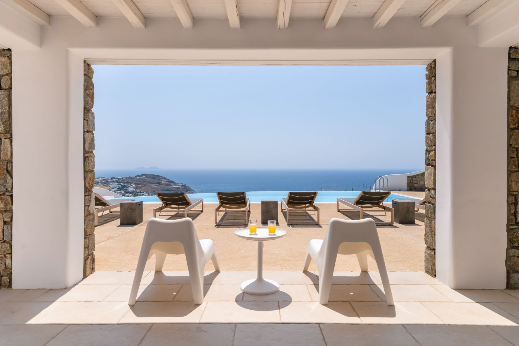 Covered seating area with sea view at Villa Kallos, Mykonos