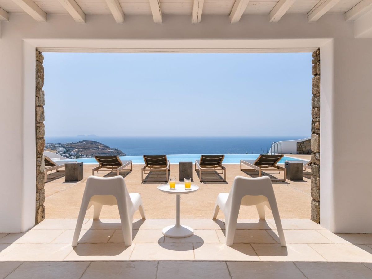 Covered seating area with sea view at Villa Kallos, Mykonos