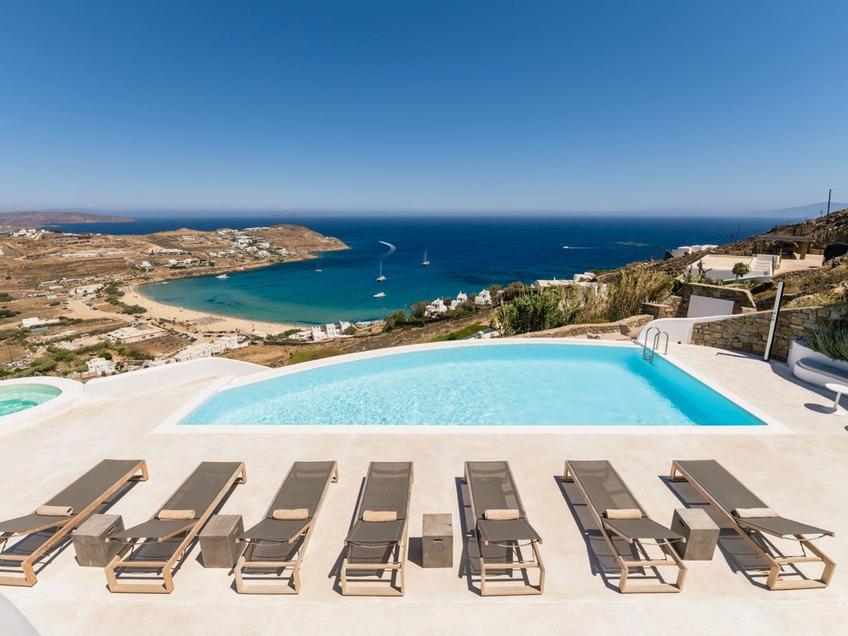 Pool and sun loungers with sea view at Villa Kallos, Mykonos