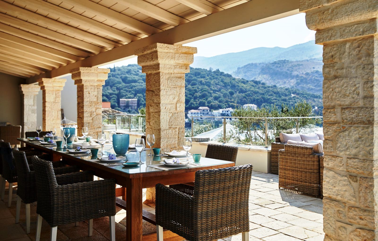 long table and chairs on the outside dining terrace at villa castro on Corfu