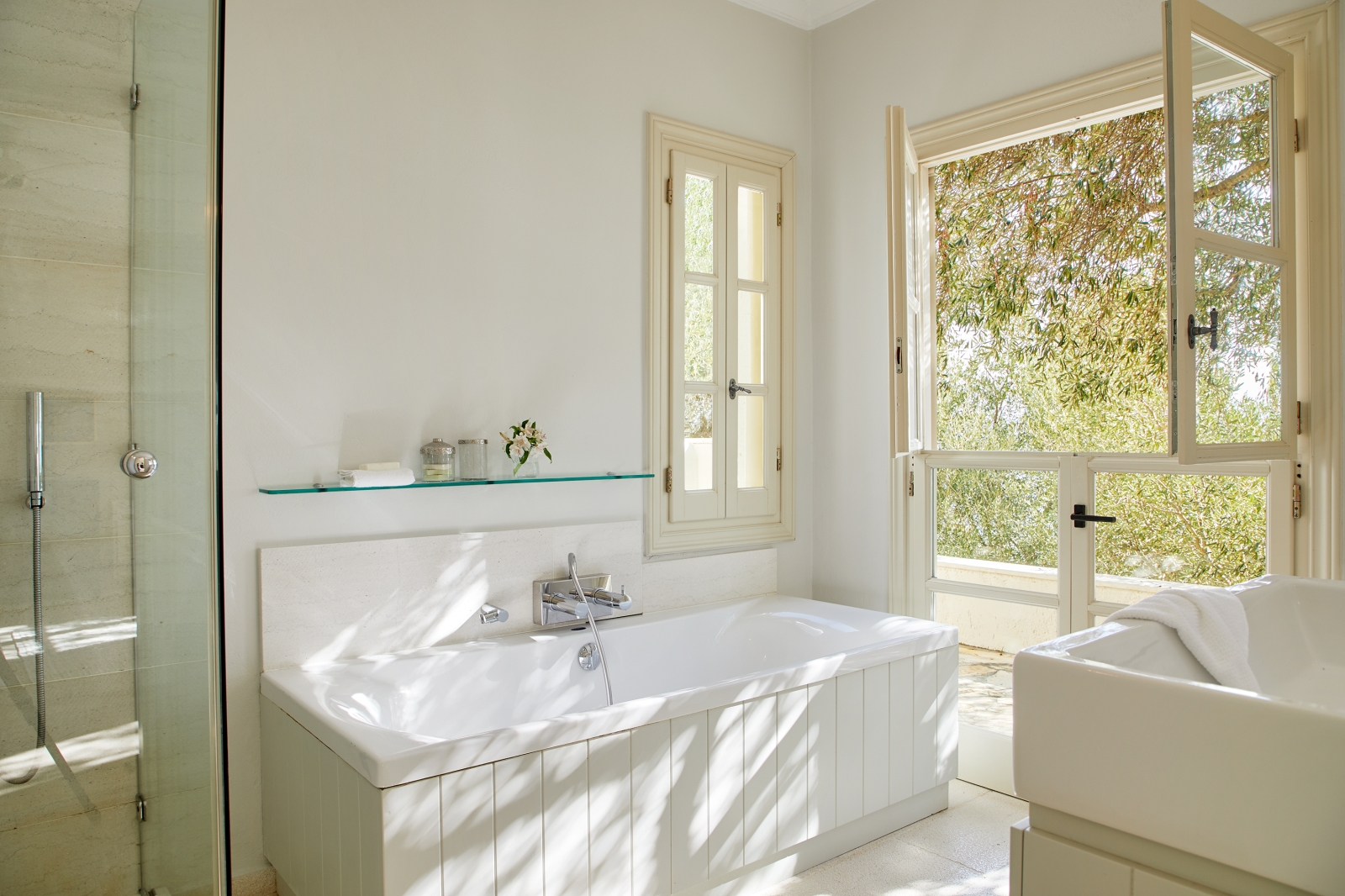 White bathroom with tub and shower at Villa Kerasia in Corfu
