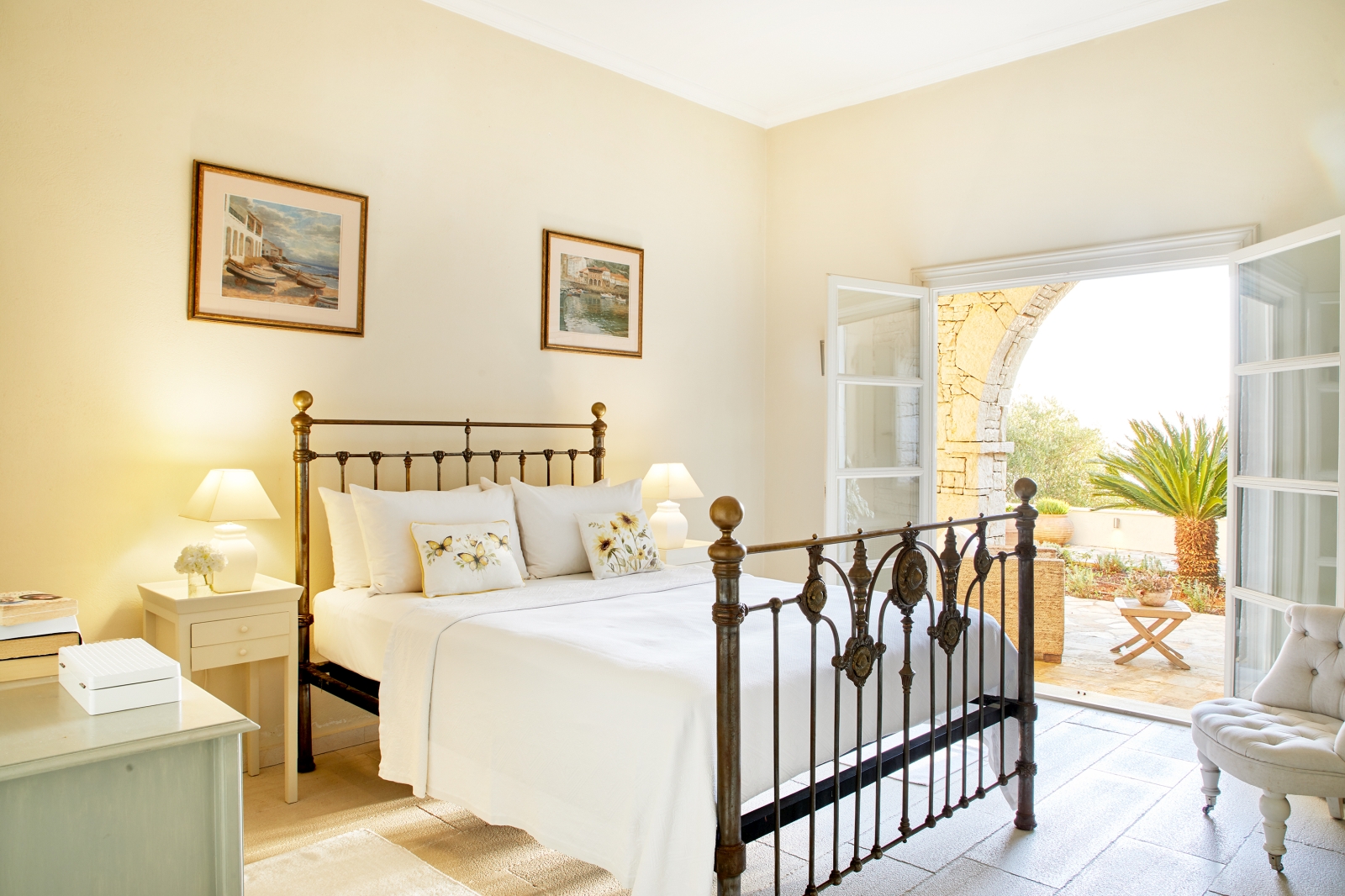 Double bedroom with door to private terrace at Villa Kerasia in Corfu