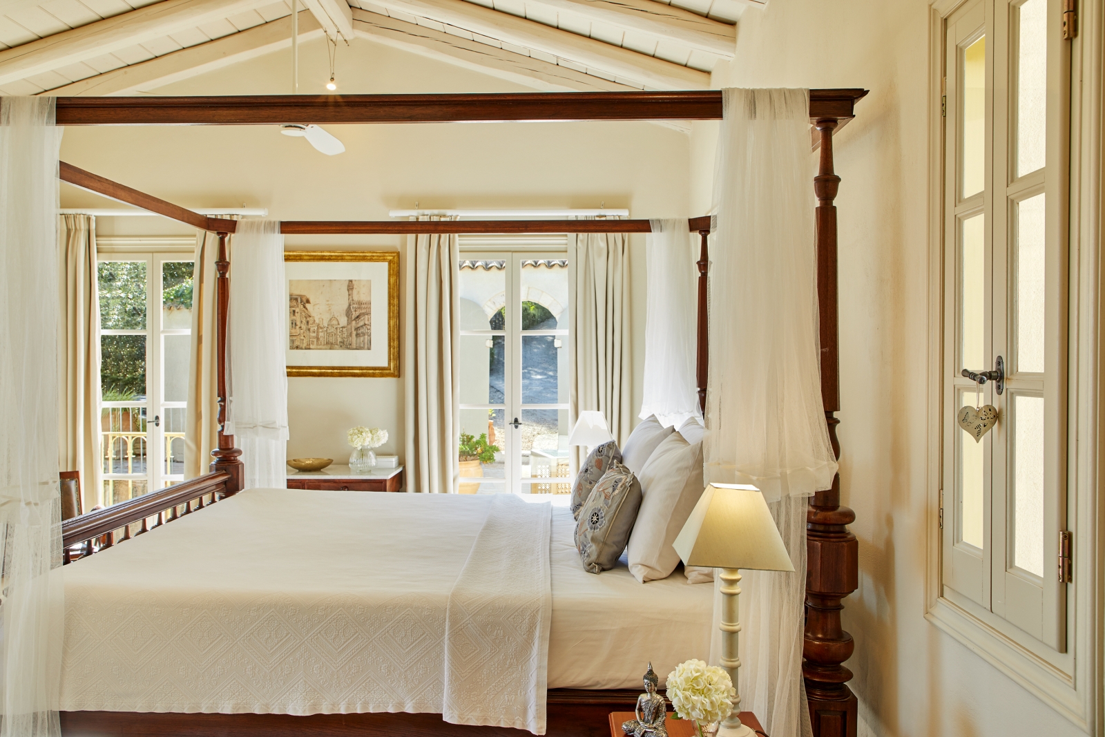 Master bedroom with four poster bed at Villa Kerasia in Corfu