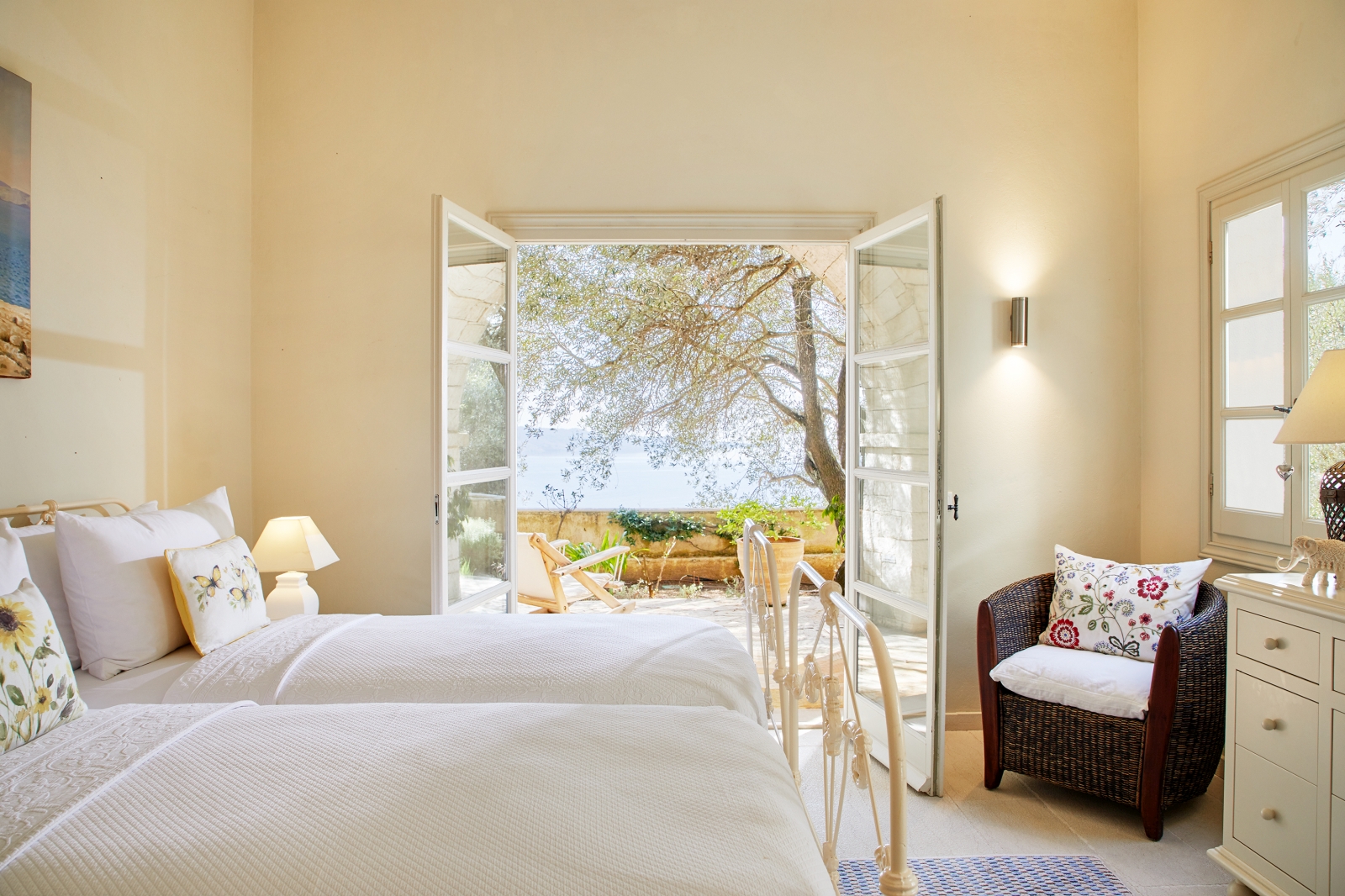 Twin bedroom with door to terrace at Villa Kerasia in Corfu