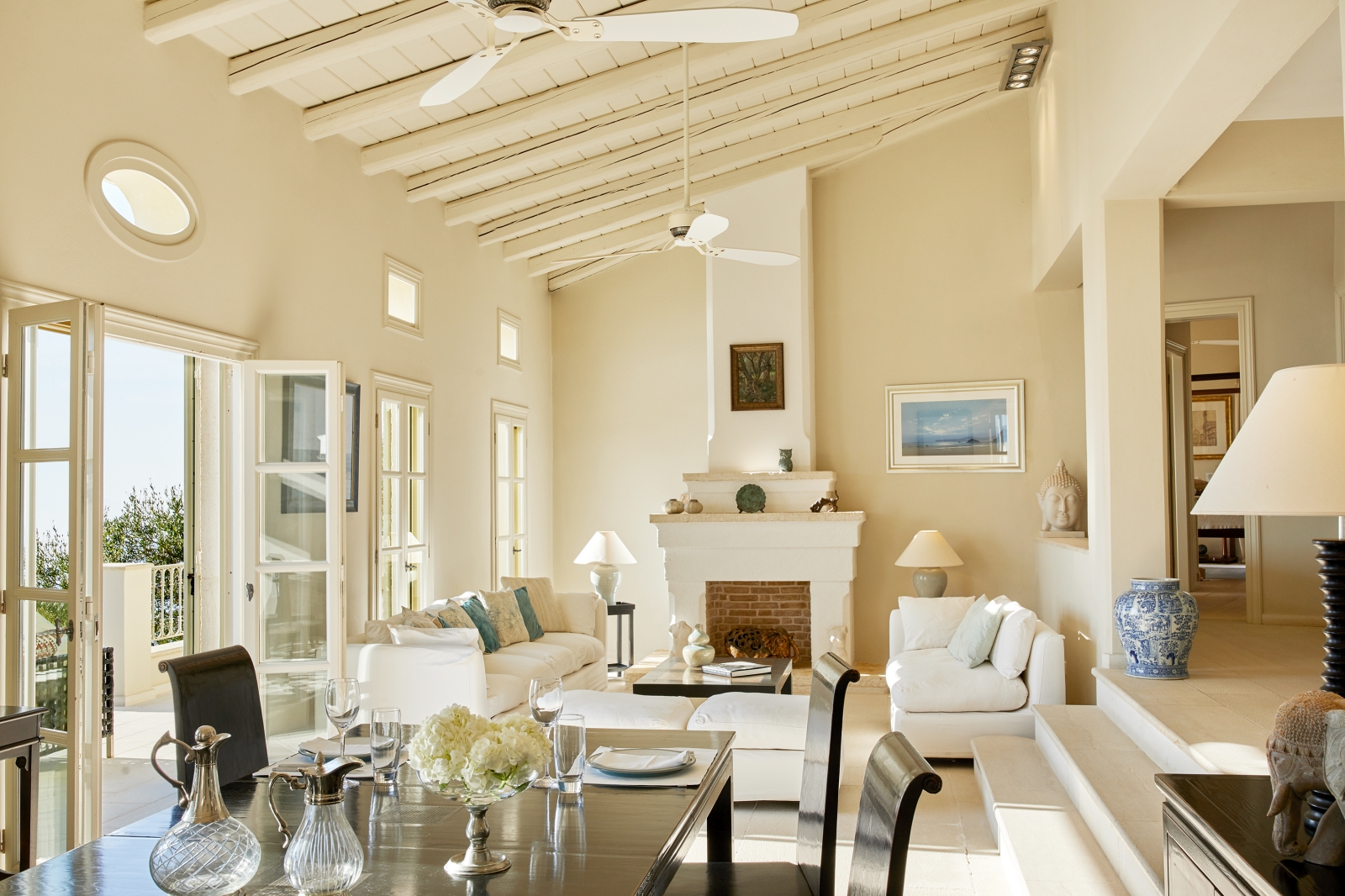 Living room with dining area at Villa Kerasia in Corfu