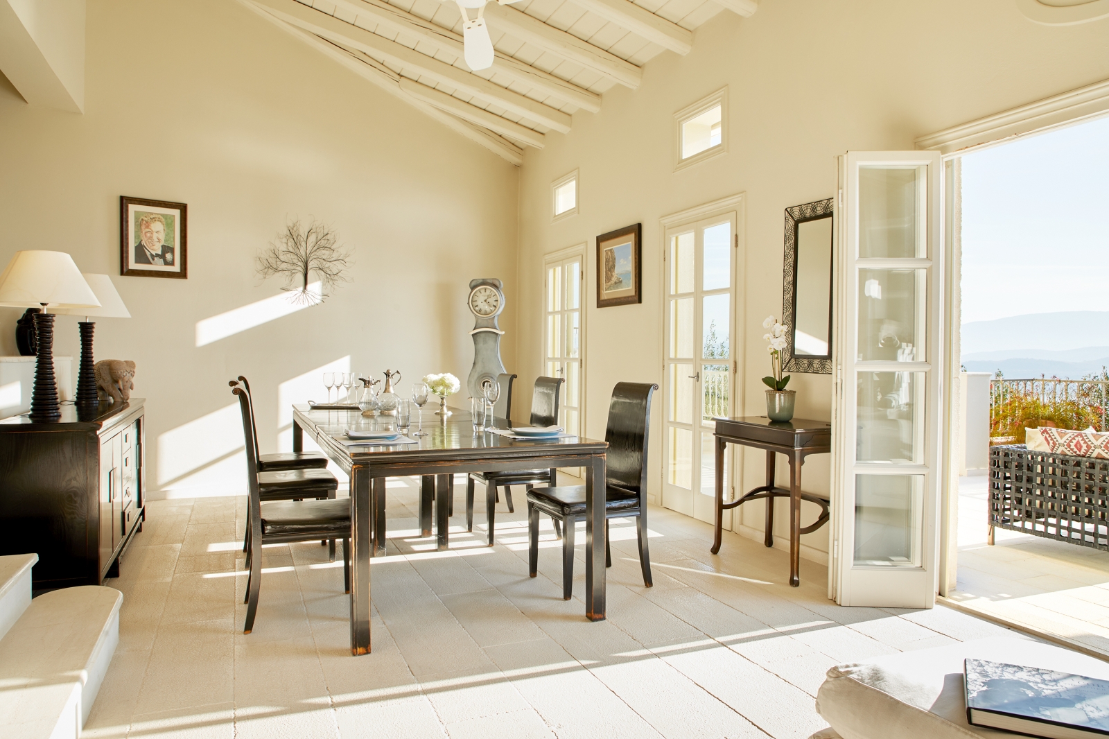Dining area with table and door to terrace at Villa Kerasia in Corfu