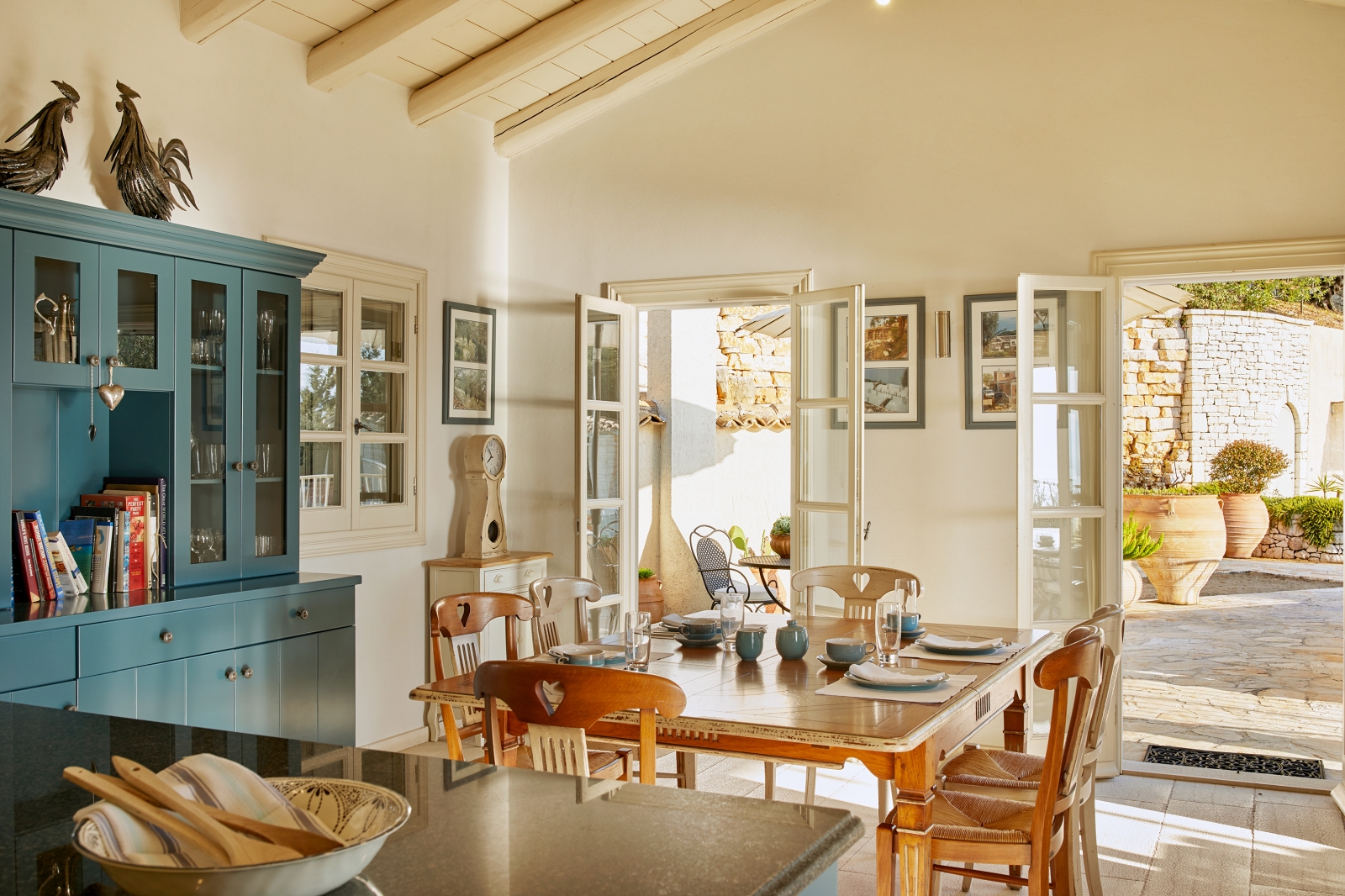 Kitchen with wooden dining table at Villa Kerasia in Corfu 