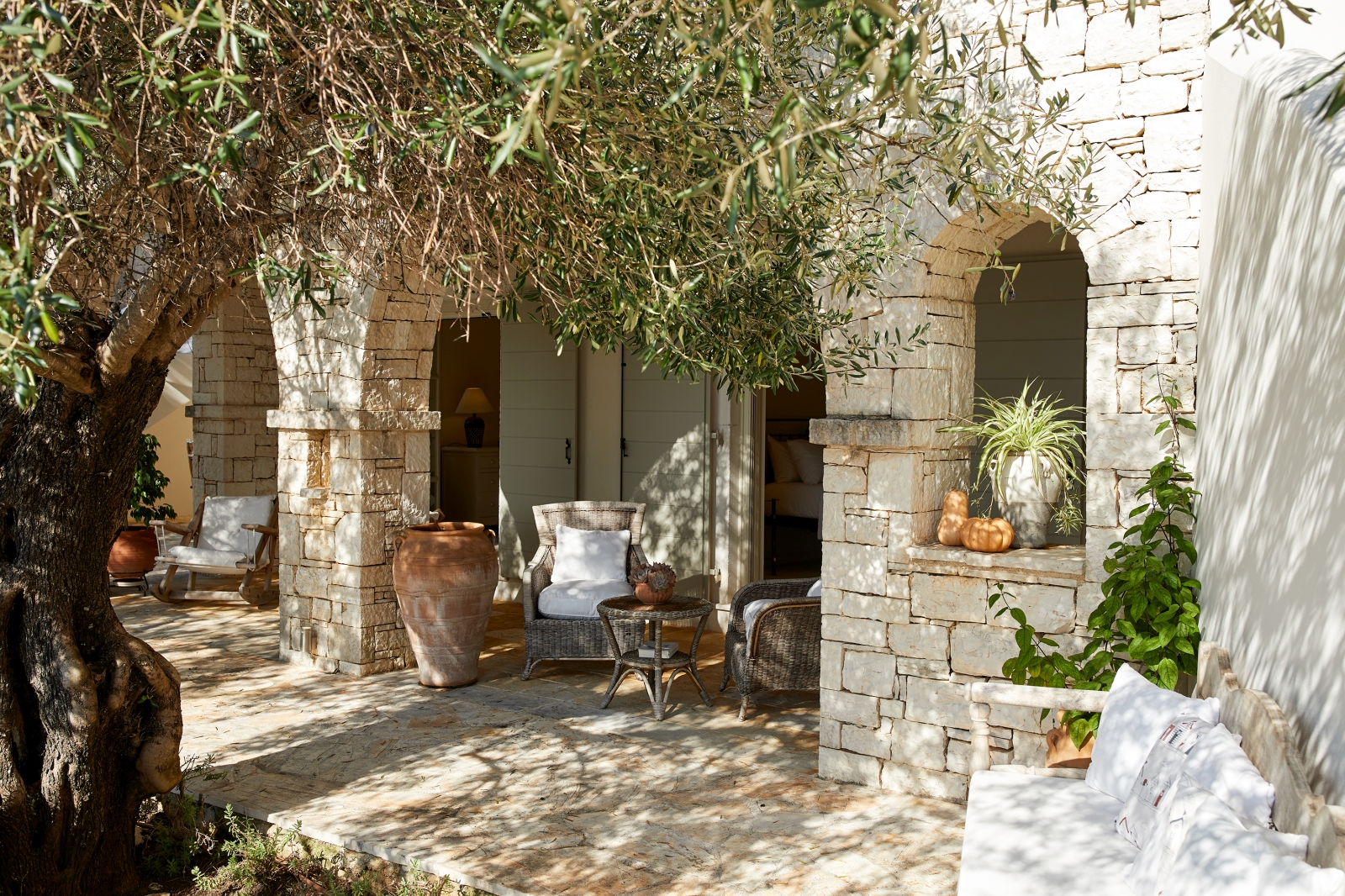 Shaded outdoor area with seating at Villa Kerasia in Corfu