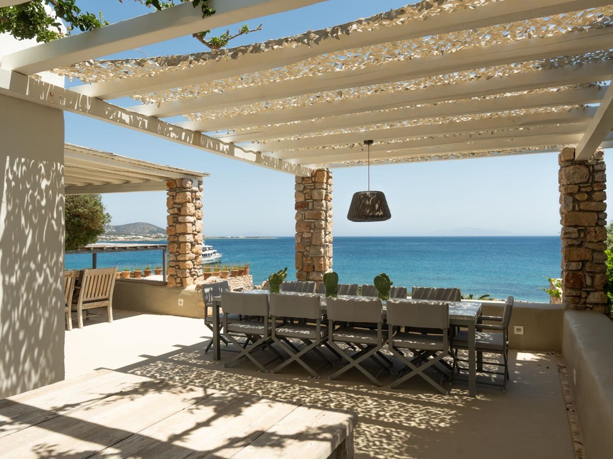 Outdoor dining terrace with sea view at Villa Kymata, Paros