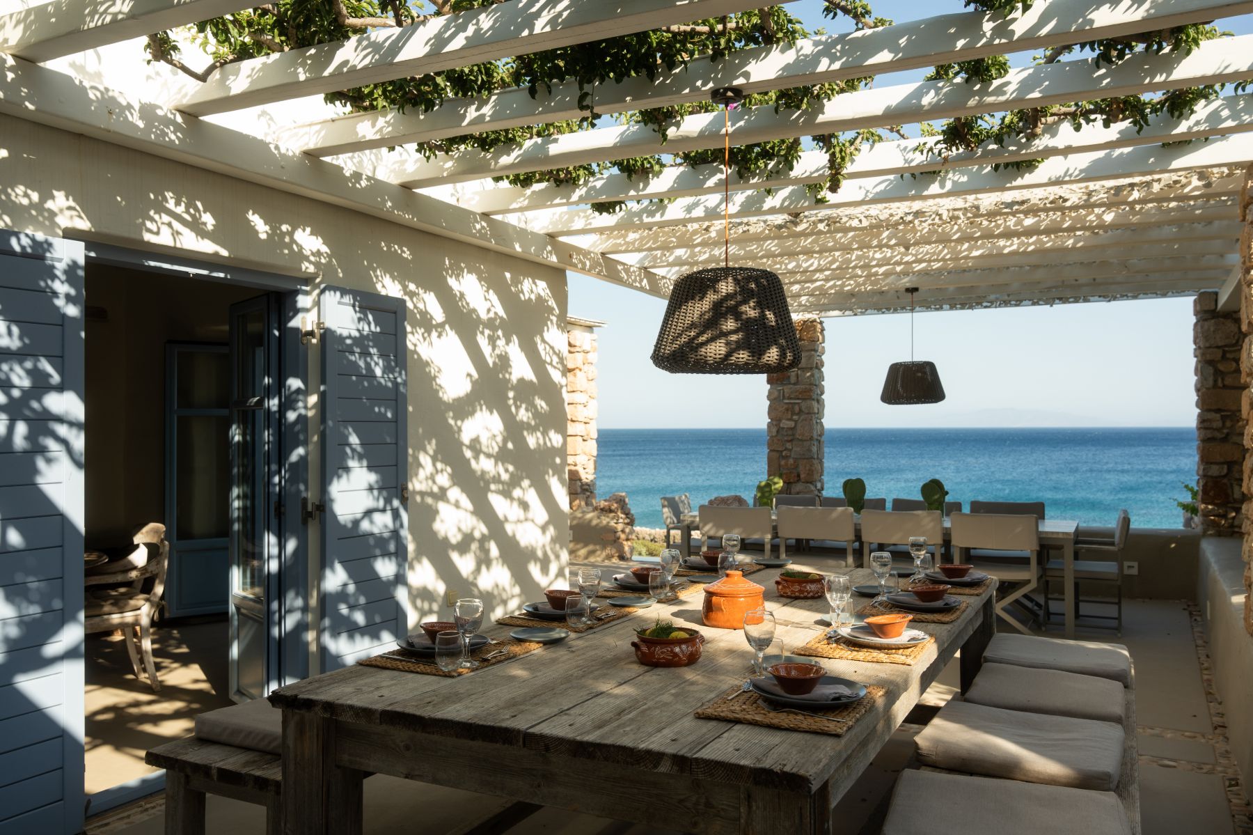 Terrace with dining table at Villa Kymata, Paros