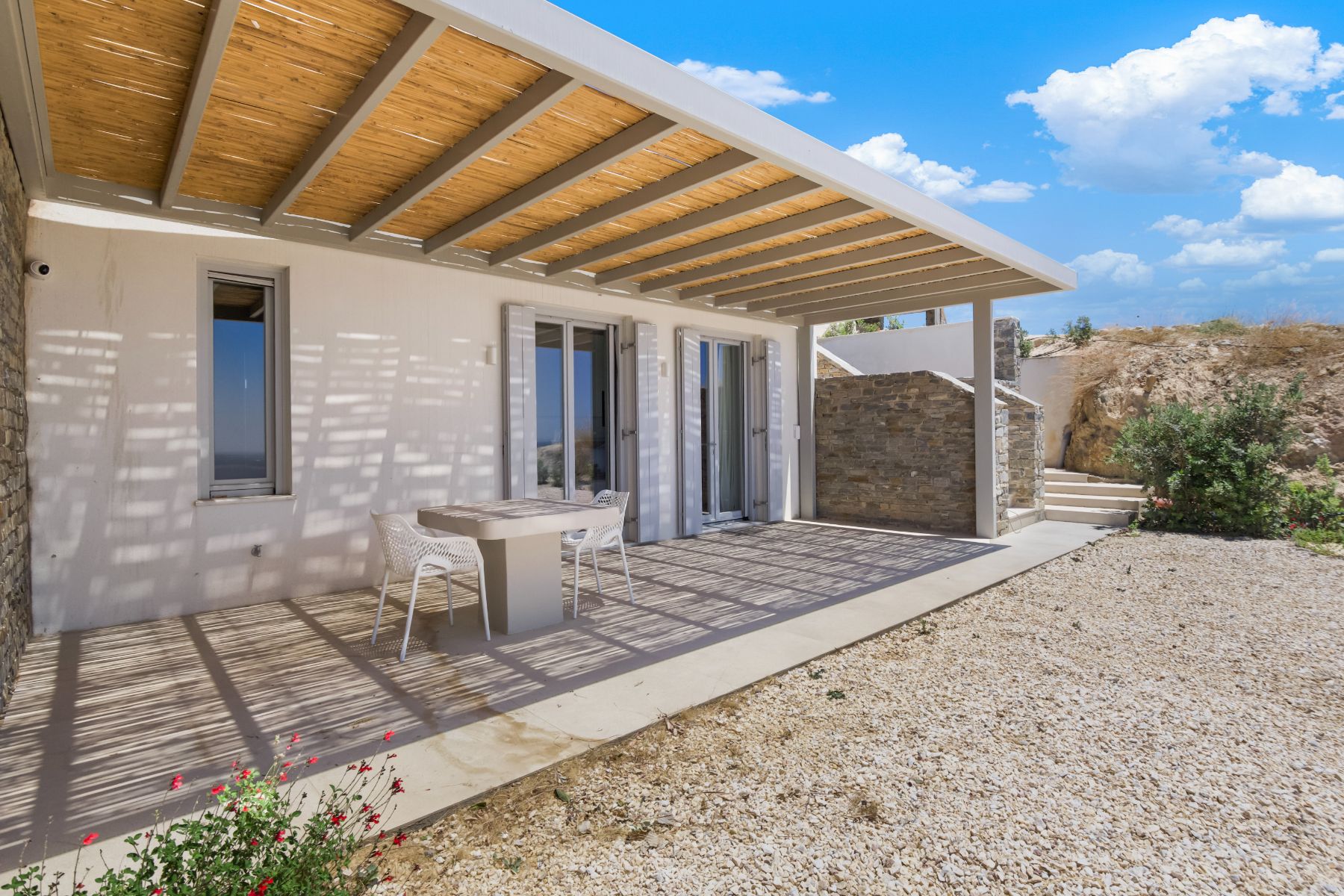 Covered terrace with seating at Villa Lara, Paros