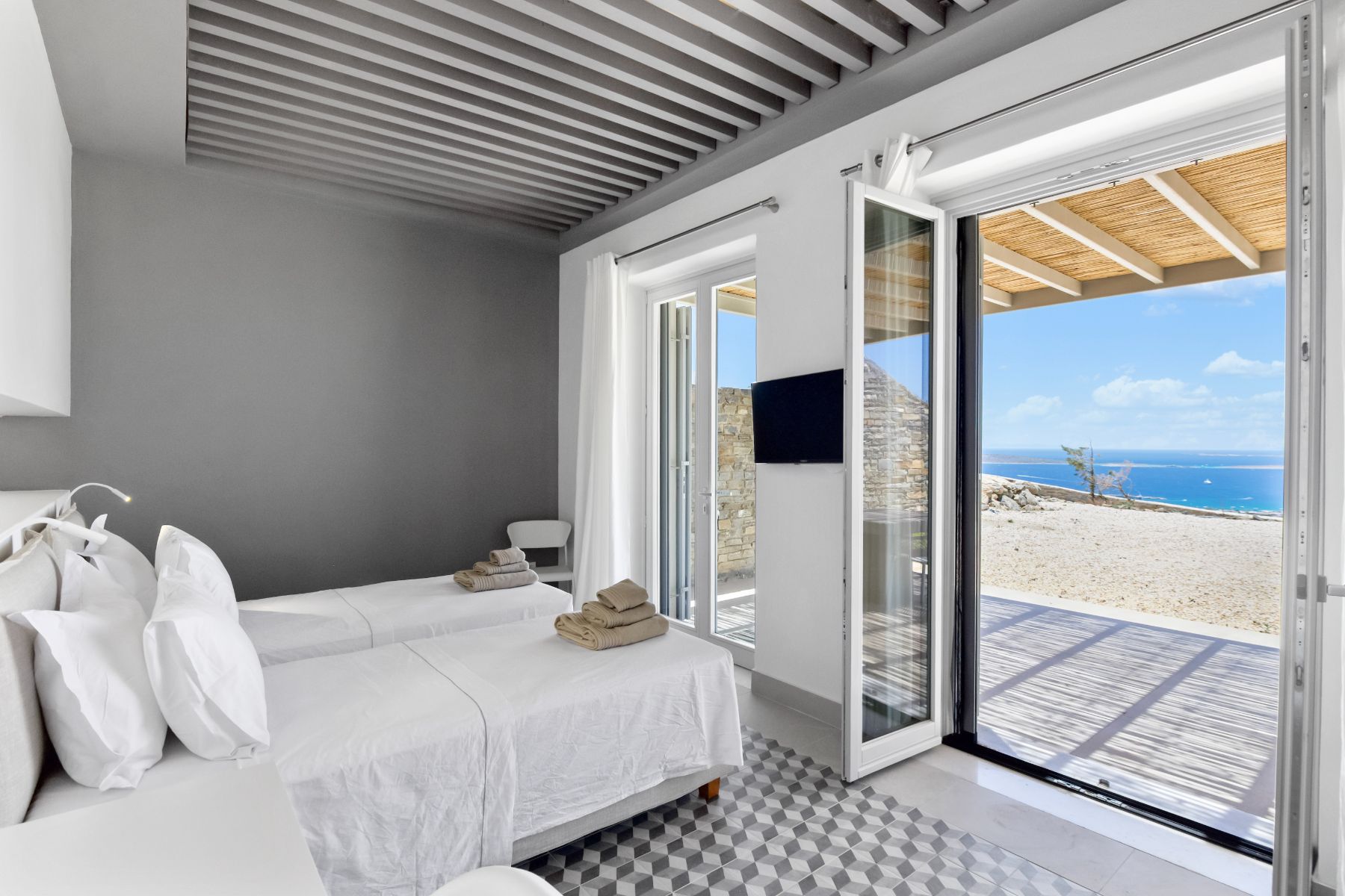 Twin bedroom with sea view at Villa Lara, Paros