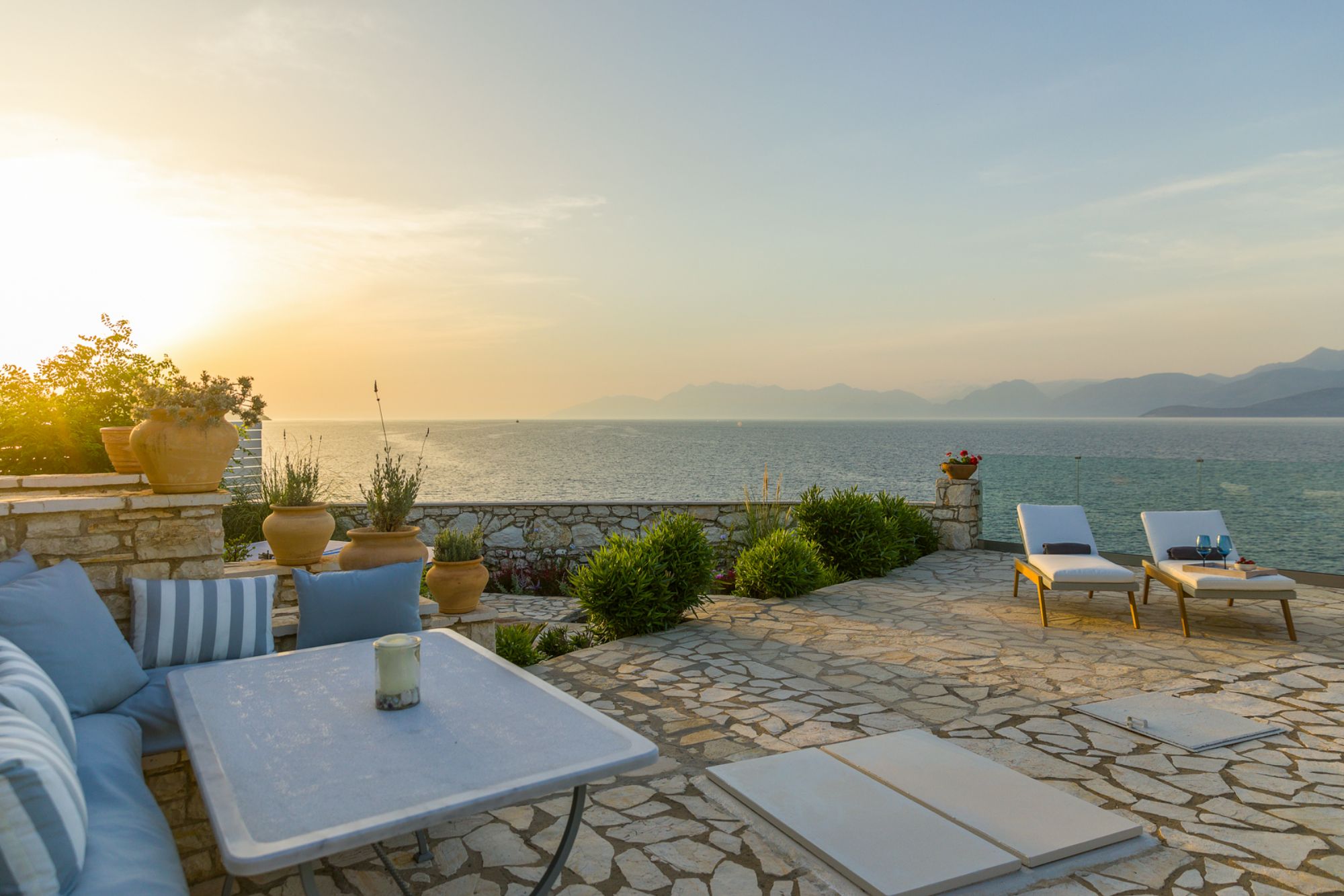 Evening view of the terrace and outdoor seating at Villa Laura