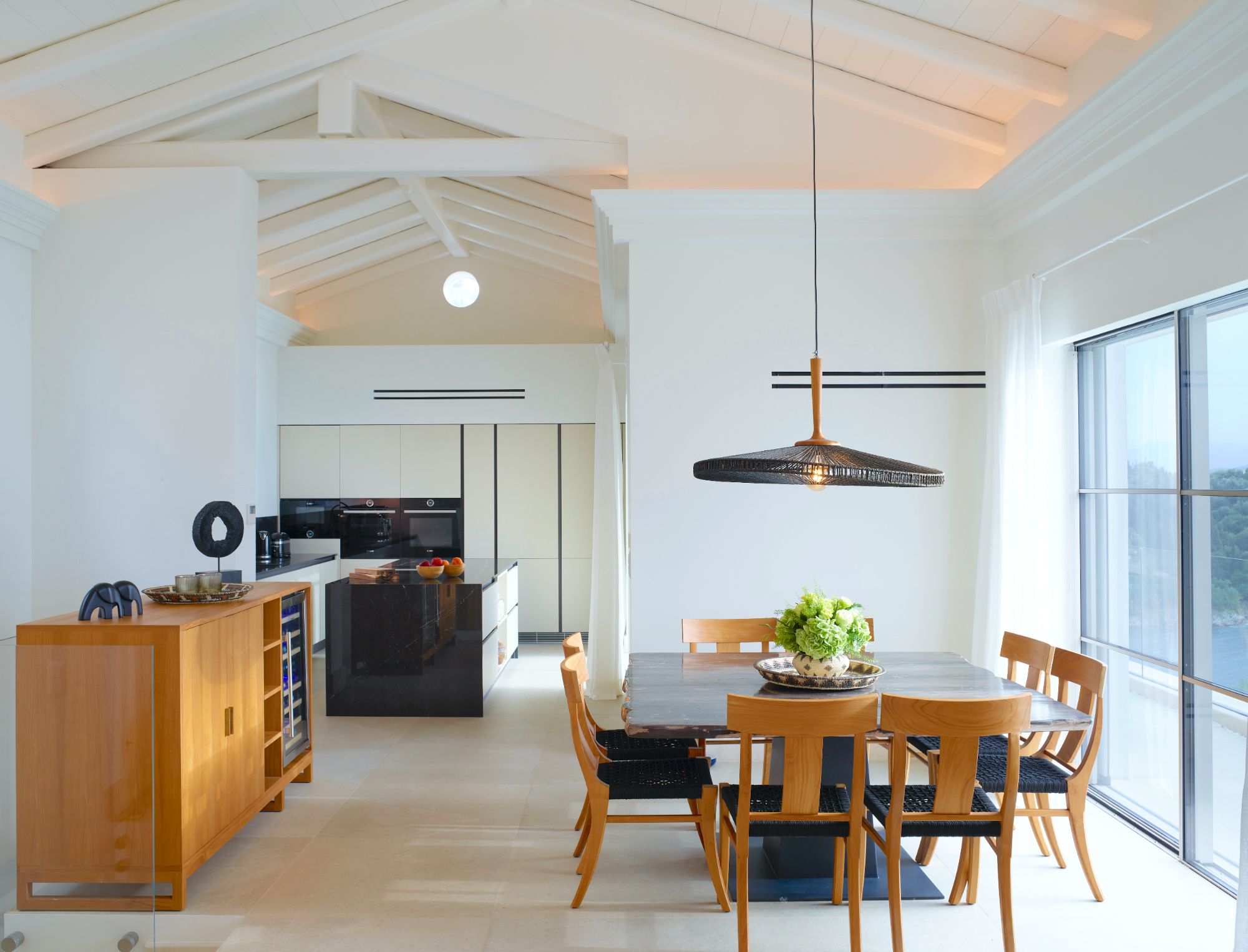 Dining area and kitchen at Villa Leonidas