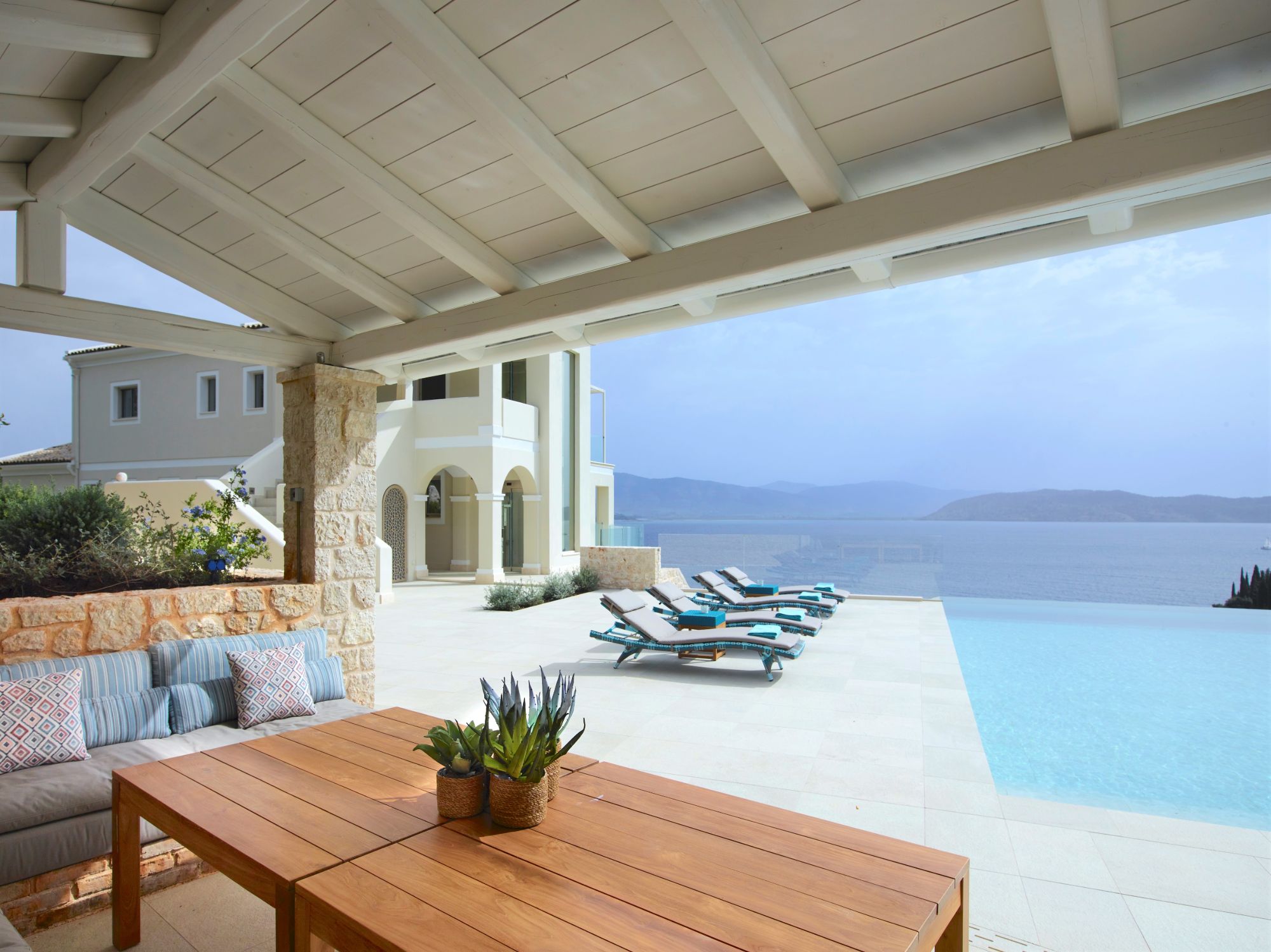 Pool and outdoor seating area at Villa Leonidas