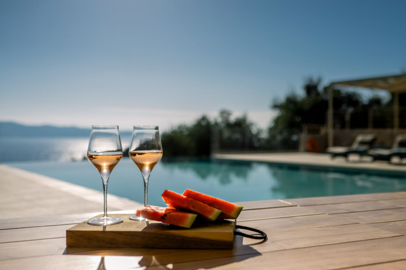 Pool with wine and fruit at Villa Leonidas